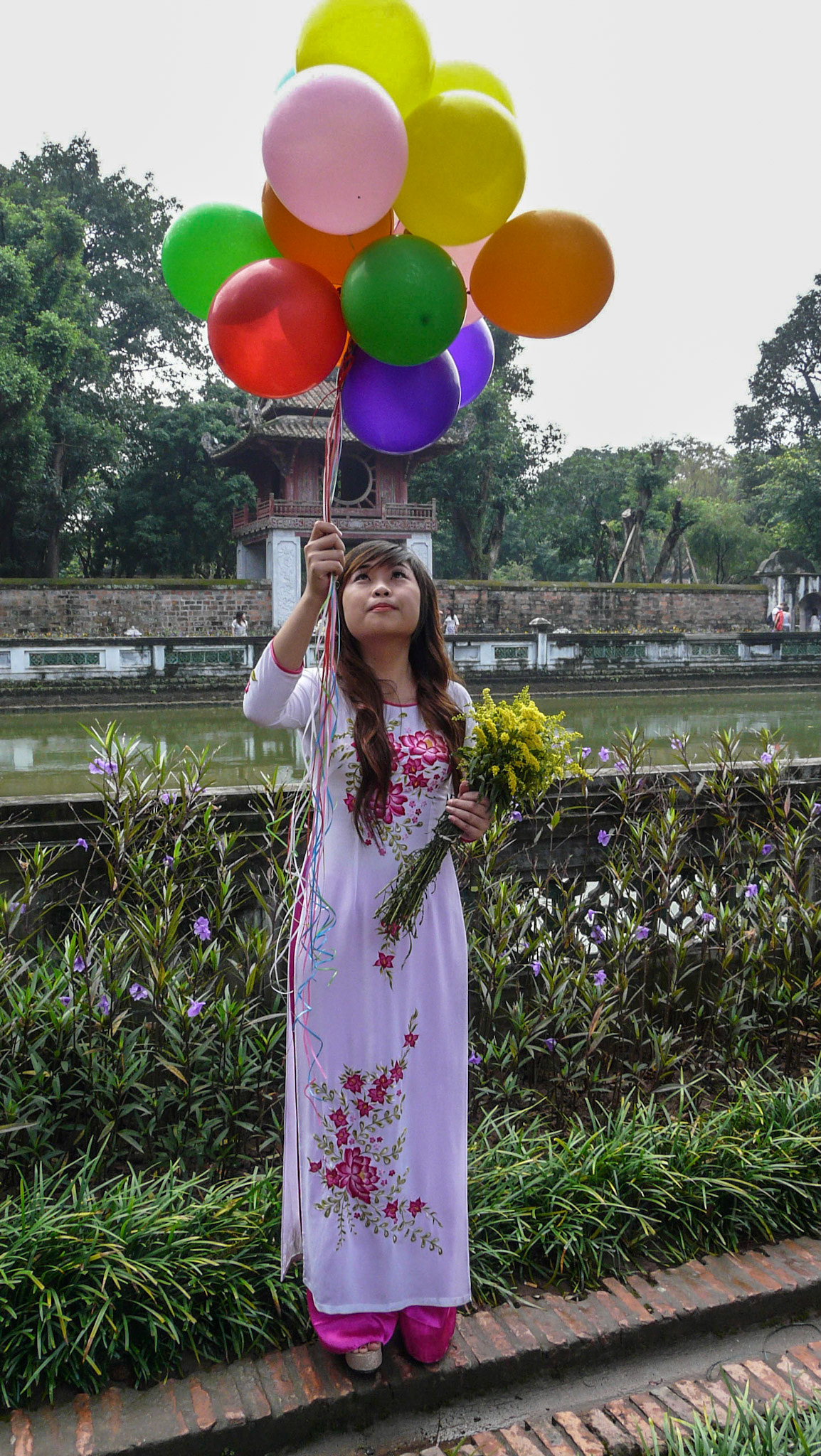 Girl with balloons at Temple Of Literature, Hanoi, Vietnam