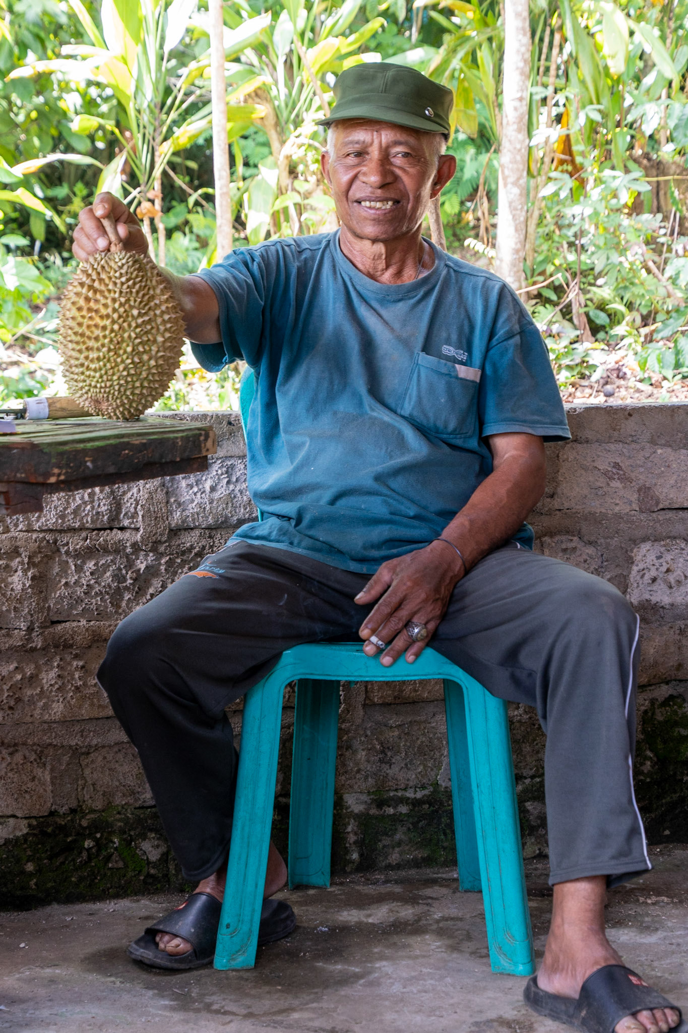 Gentleman with durian and coffee shop, Cancar, Indonesia