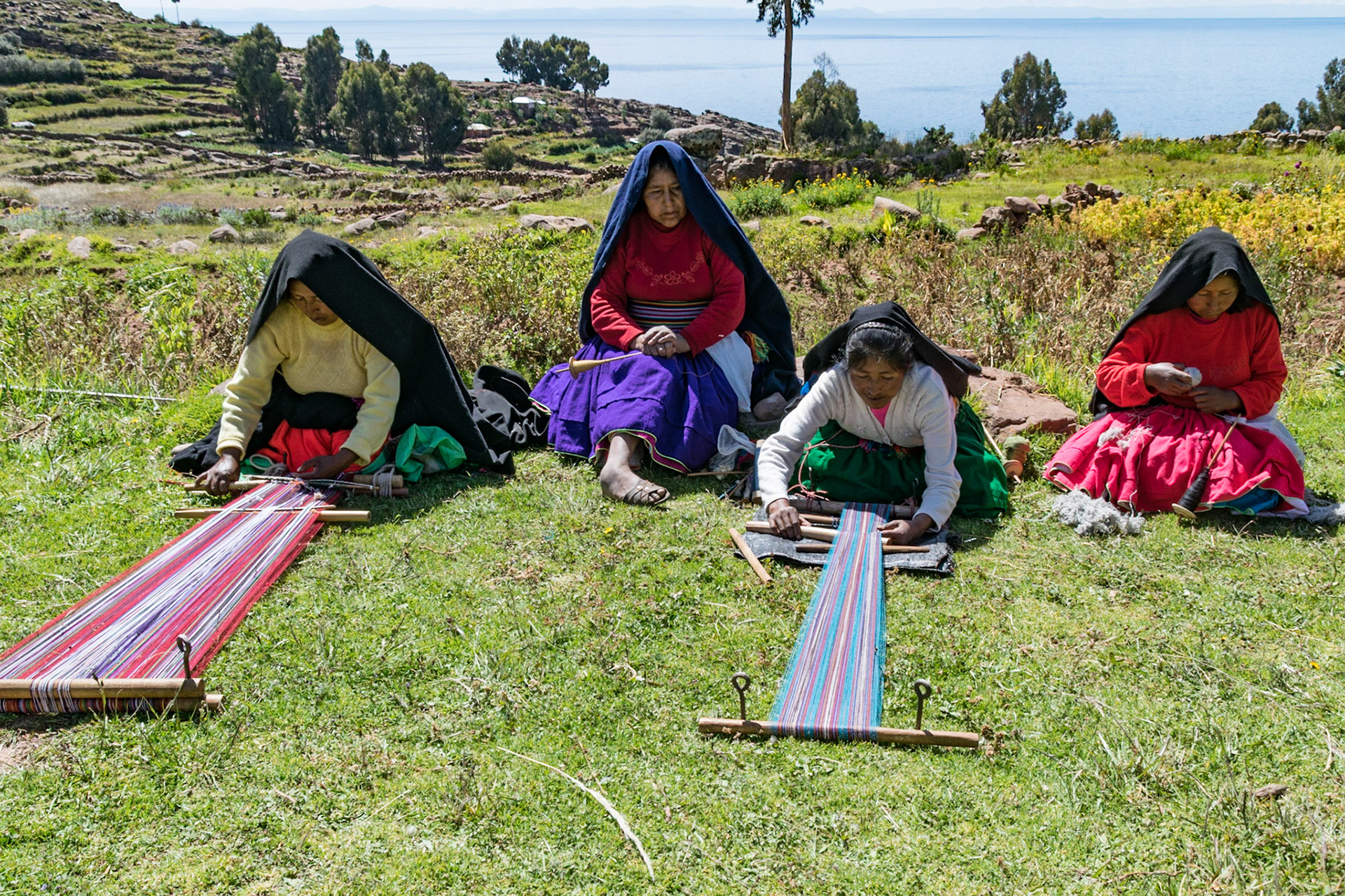 Ladies weaving and spinning, Taquile Island, Lake Titicaca, Peru