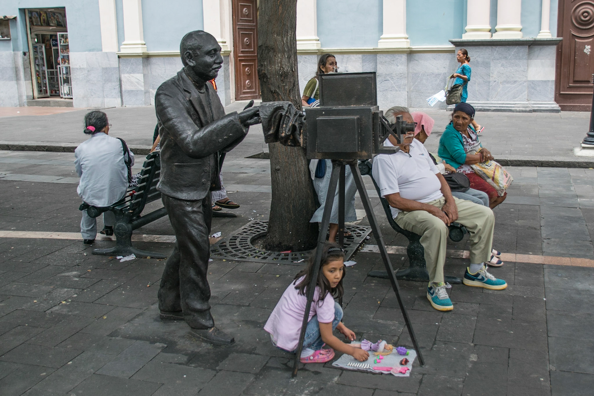 Young girl with statue, Guayaquil, Ecuador, 2018