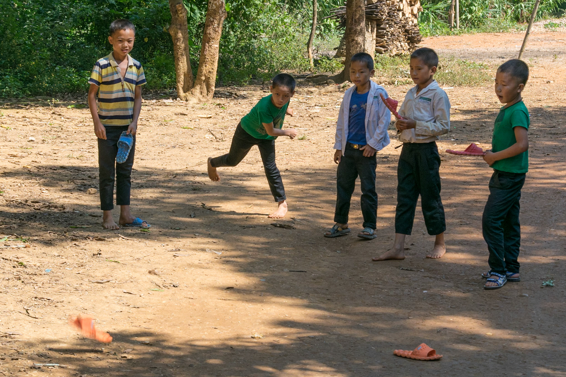 Children playing "slipper" in Hmong village, en route to Nong Khiaw, Laos, 2015
