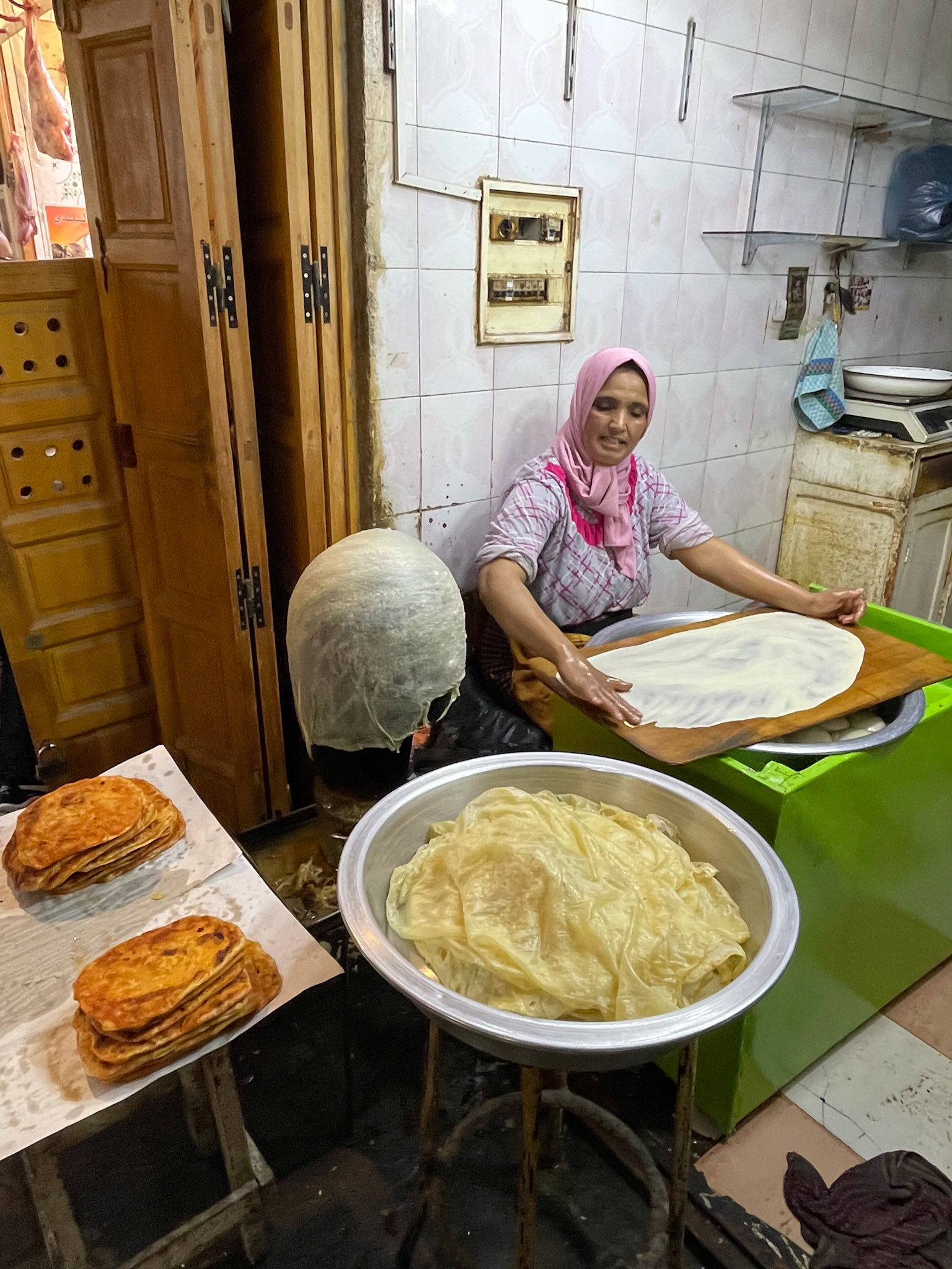Lady making bread, Medina, Fes, Morocco, 2021