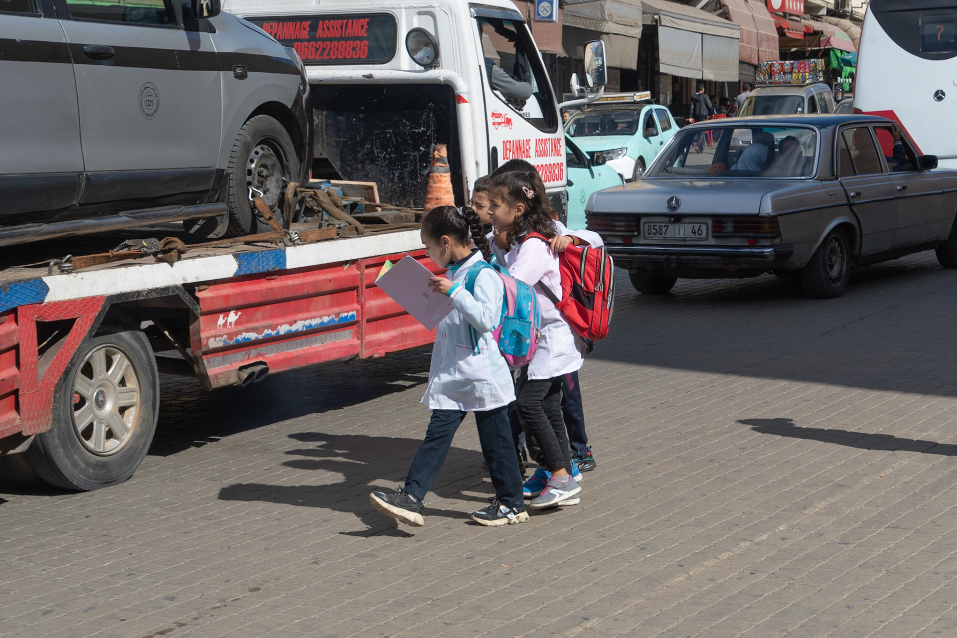 School-children crossing busy road, Meknes, Morocco