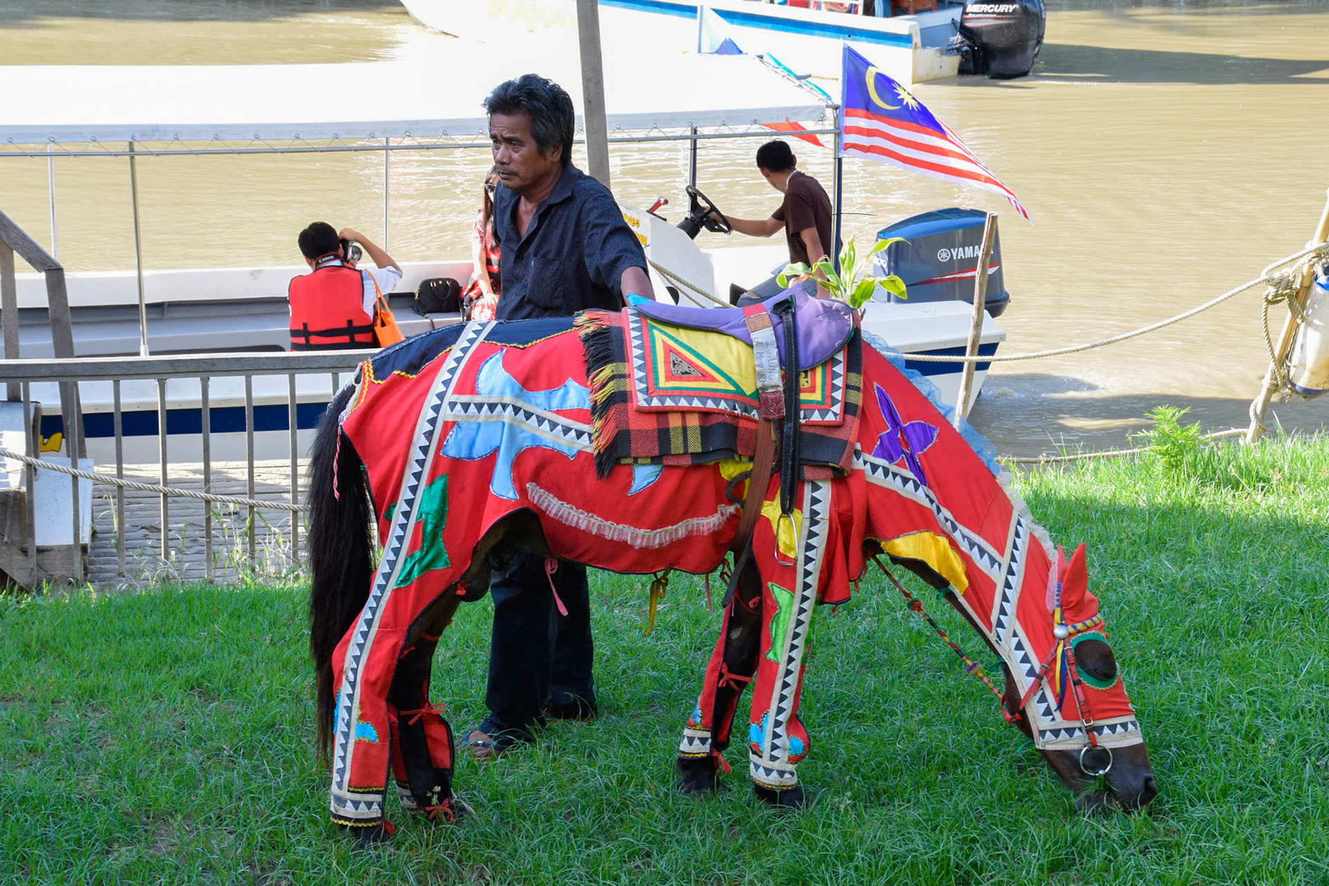 Bajau man with horse, near Kota Belud, Malaysia