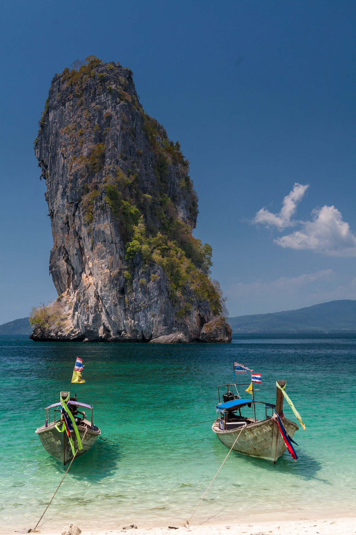 Rock at Poda Island with two boats