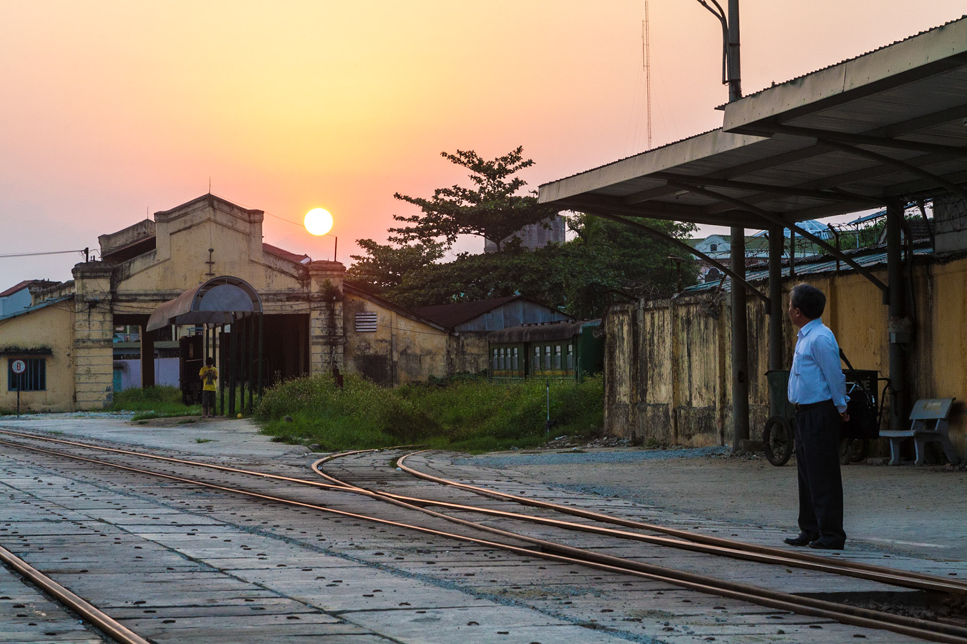 The setting sun at the Hue Train Station before boarding the night train to Hanoi (Vietnam)