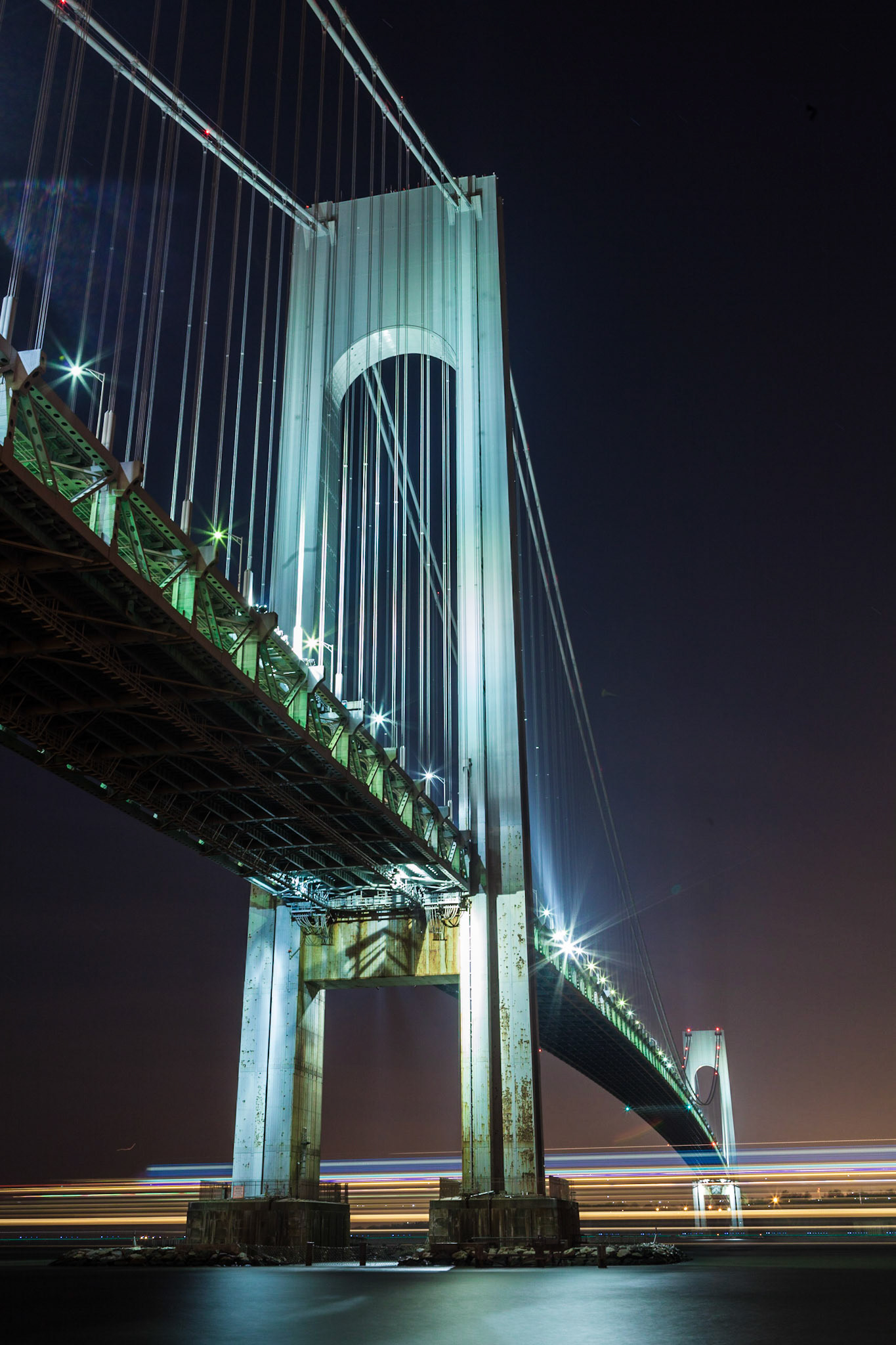 The Verrazano Narrows Bridge, taken during twilight while a cruise ship was passing under the bridge.