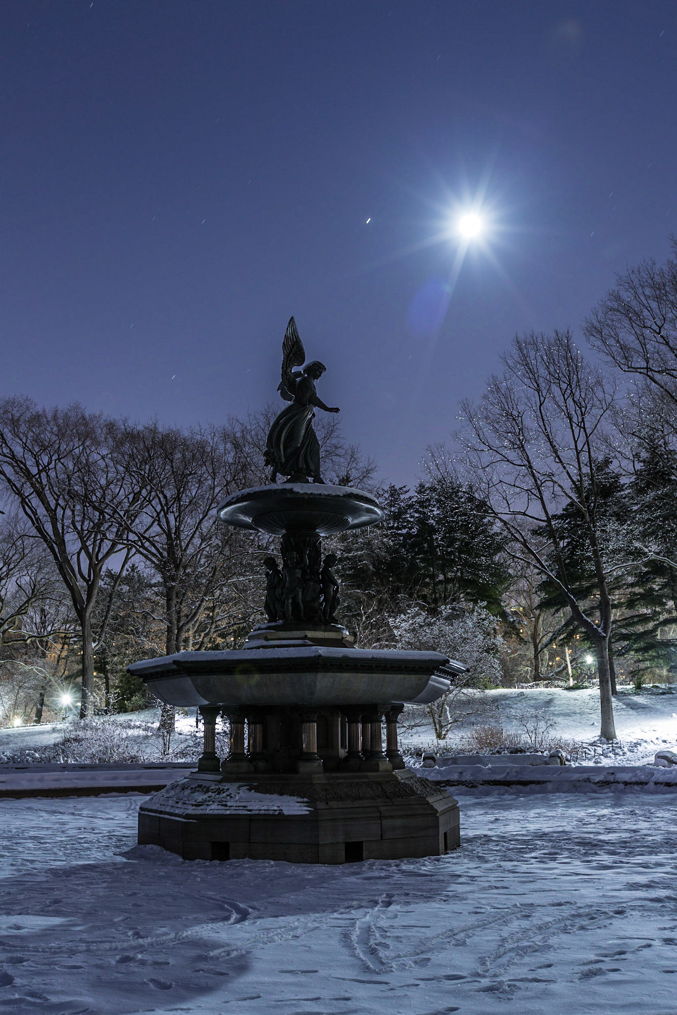 Bethesda Fountain in Central Park with the rising full moon at night