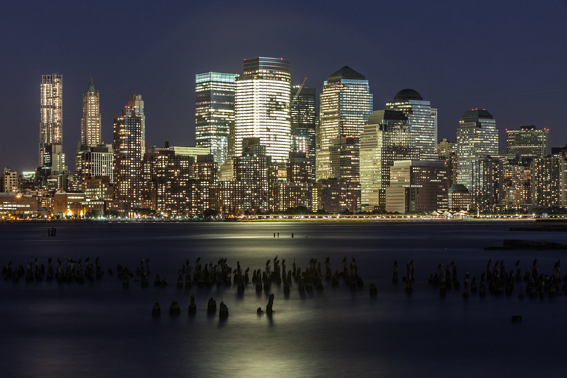 A long exposure image of Lower Manhattan with the World Financial Center, taken from the Hoboken Terminal on the New Jersey side.