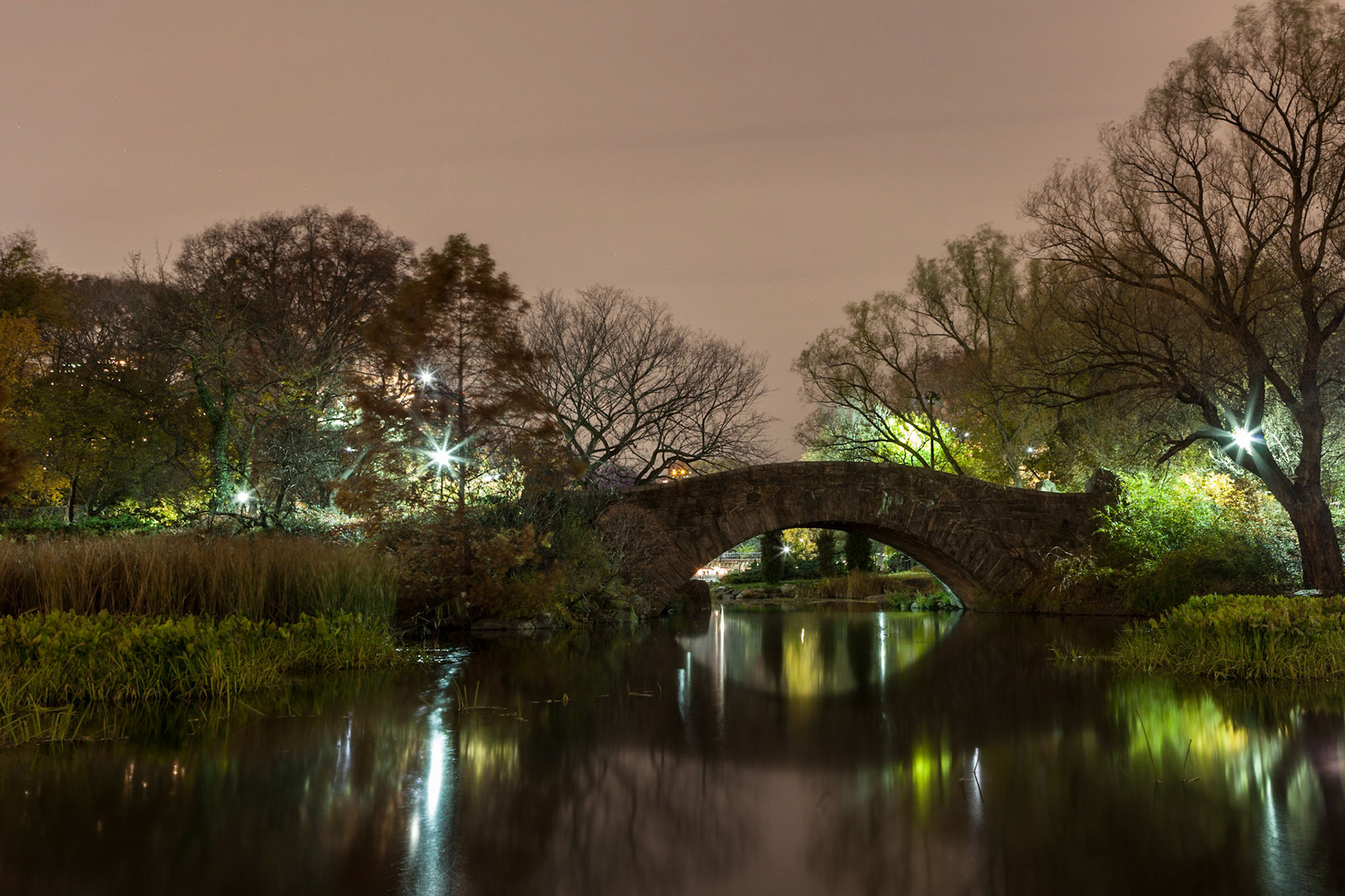 Gapstow Bridge over "The Pond" in the southeast corner of Central Park, this time shot from the south into the park. This exposure almost yielded a painting-like result. I like the very subtle tones and the not so overpowering lights from the park's lanterns.