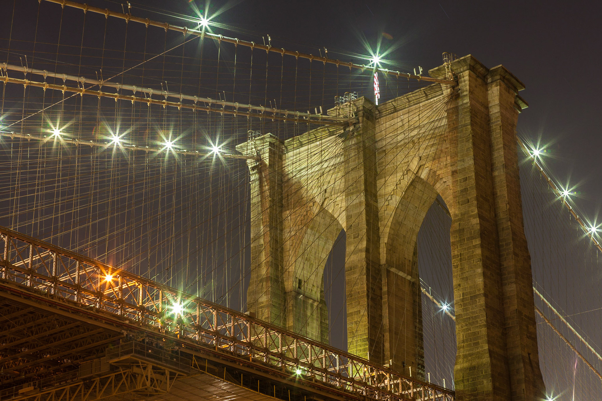 Brooklyn Bridge pylon at night from the Brooklyn side