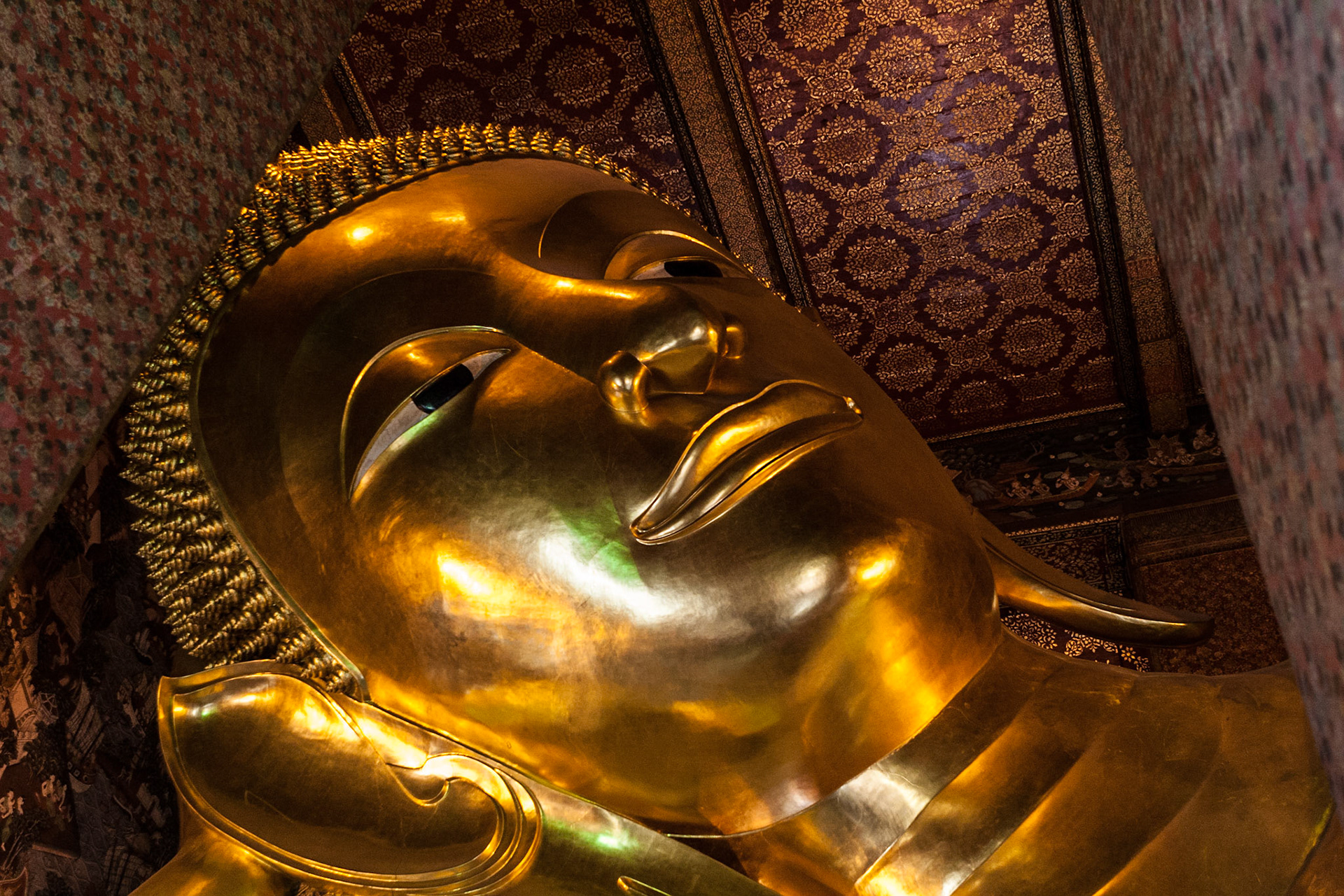 The Large Reclining Buddha (46m long, 15m high) at Wat Pho, showing the passing of Buddha into nirvana