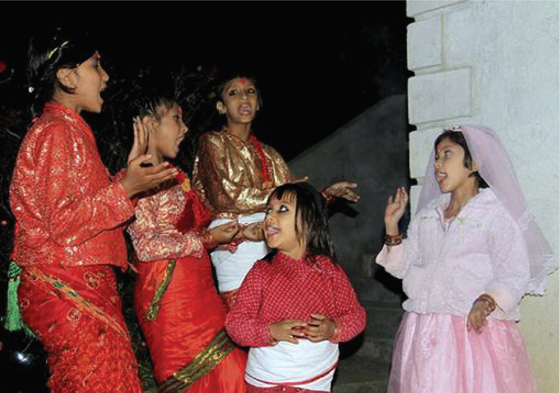 Singing & dancing to houses for Treat & money