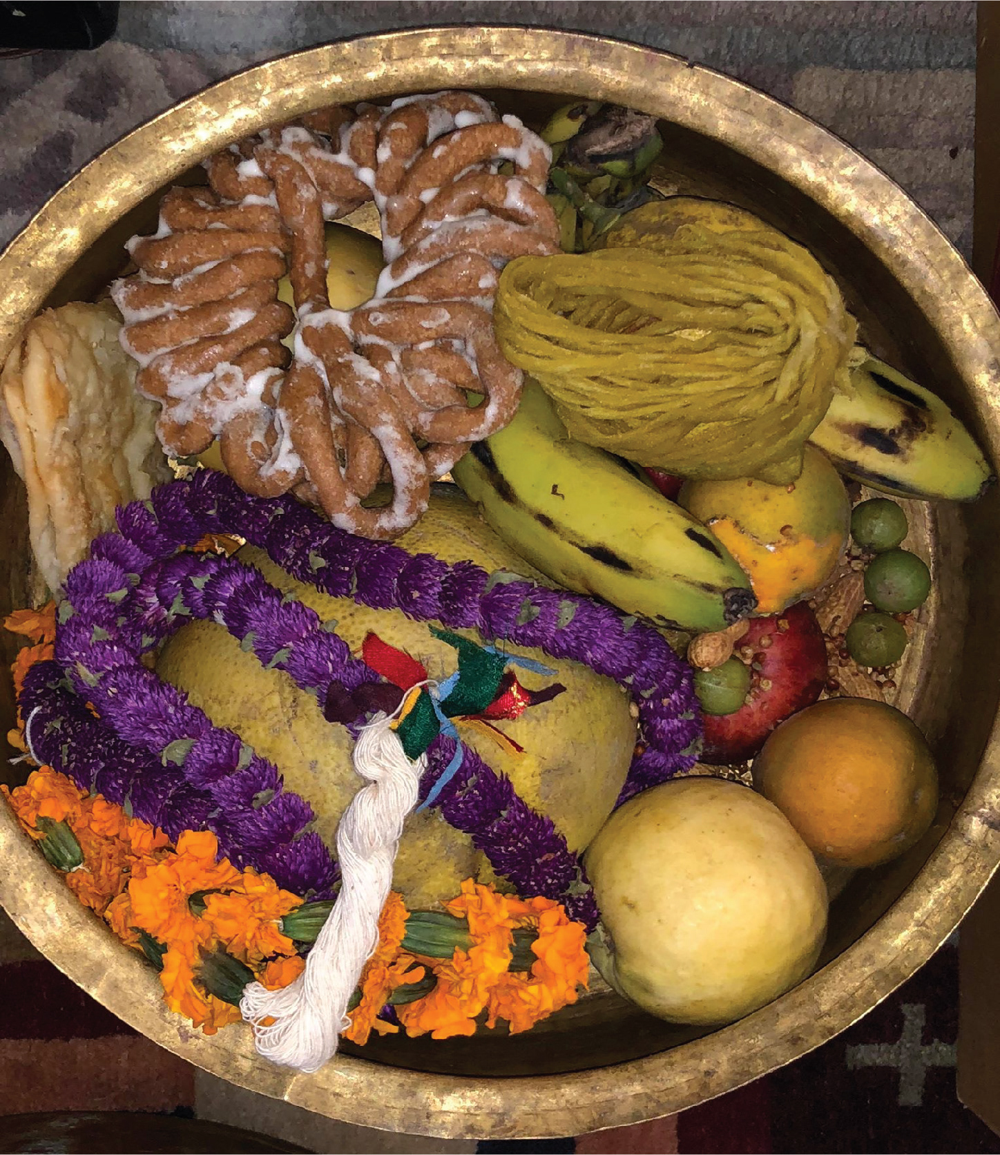 Food, fruits, dried fruits, garlands and oil lamp thread offer for the ritual puja on Mha-puja & brother-sister day