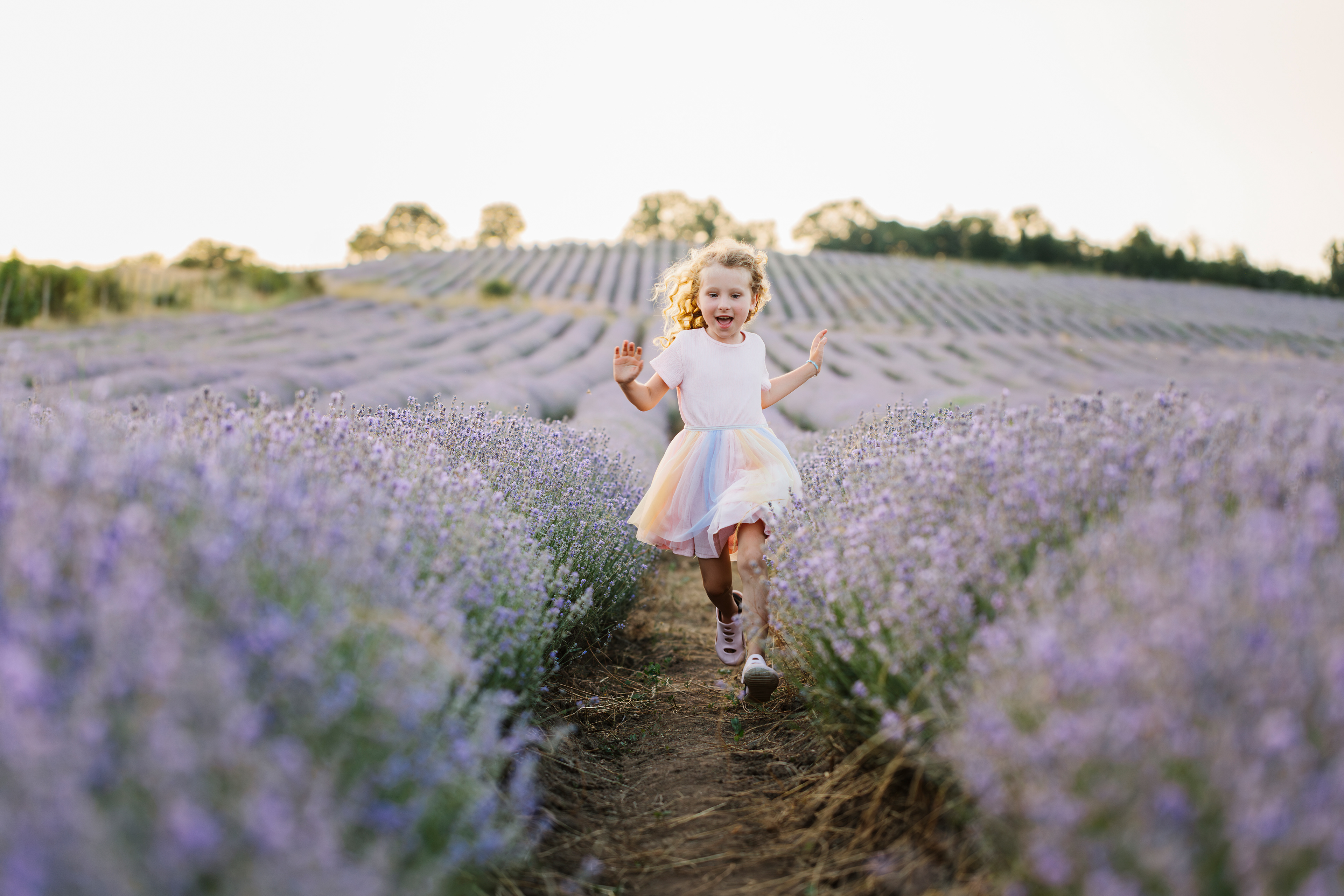 Running through lavender — pure childhood in bloom. By Svetlana Iakusheva