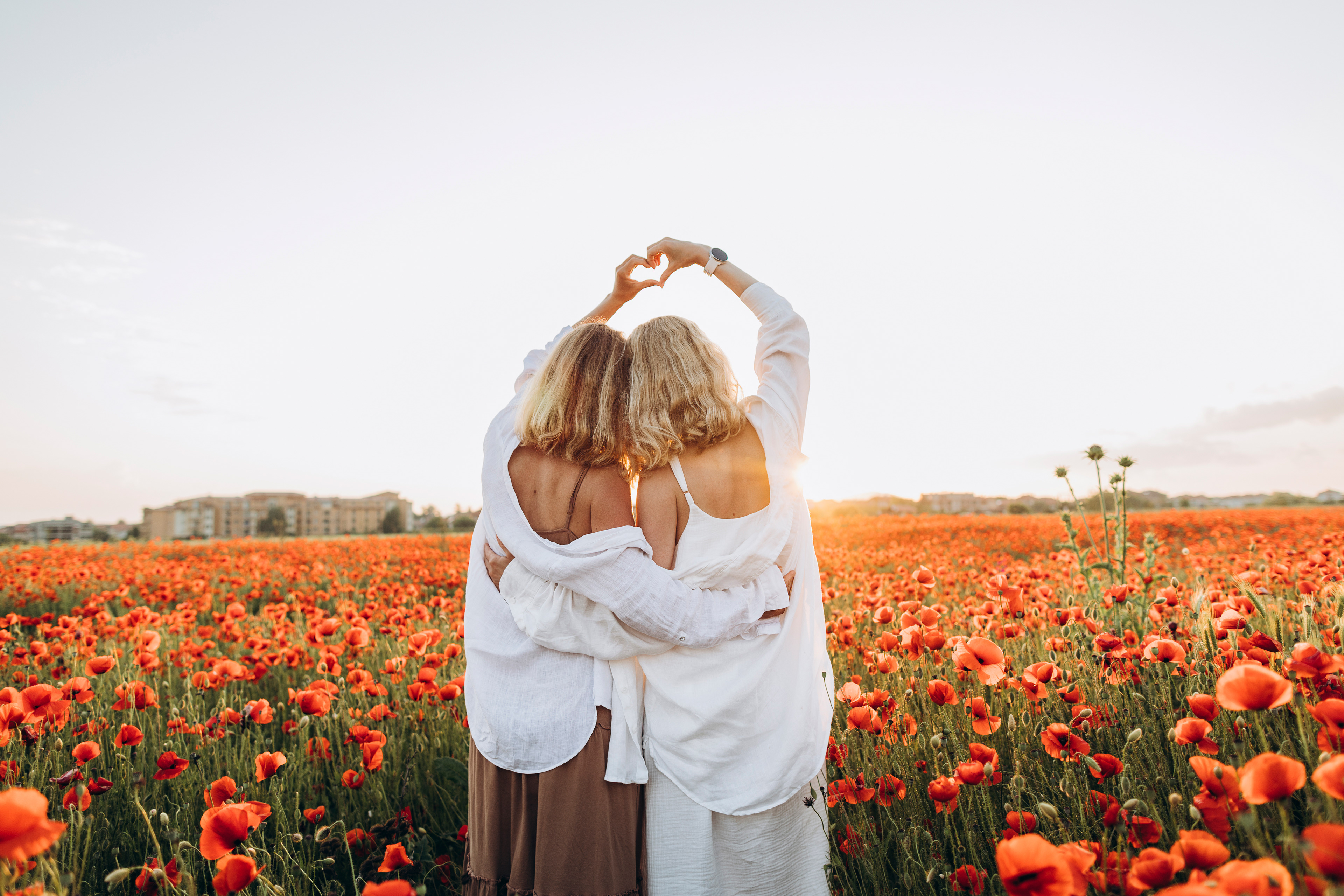 Shared hearts — the essence of sisterhood, captured in light. By Svetlana Iakusheva