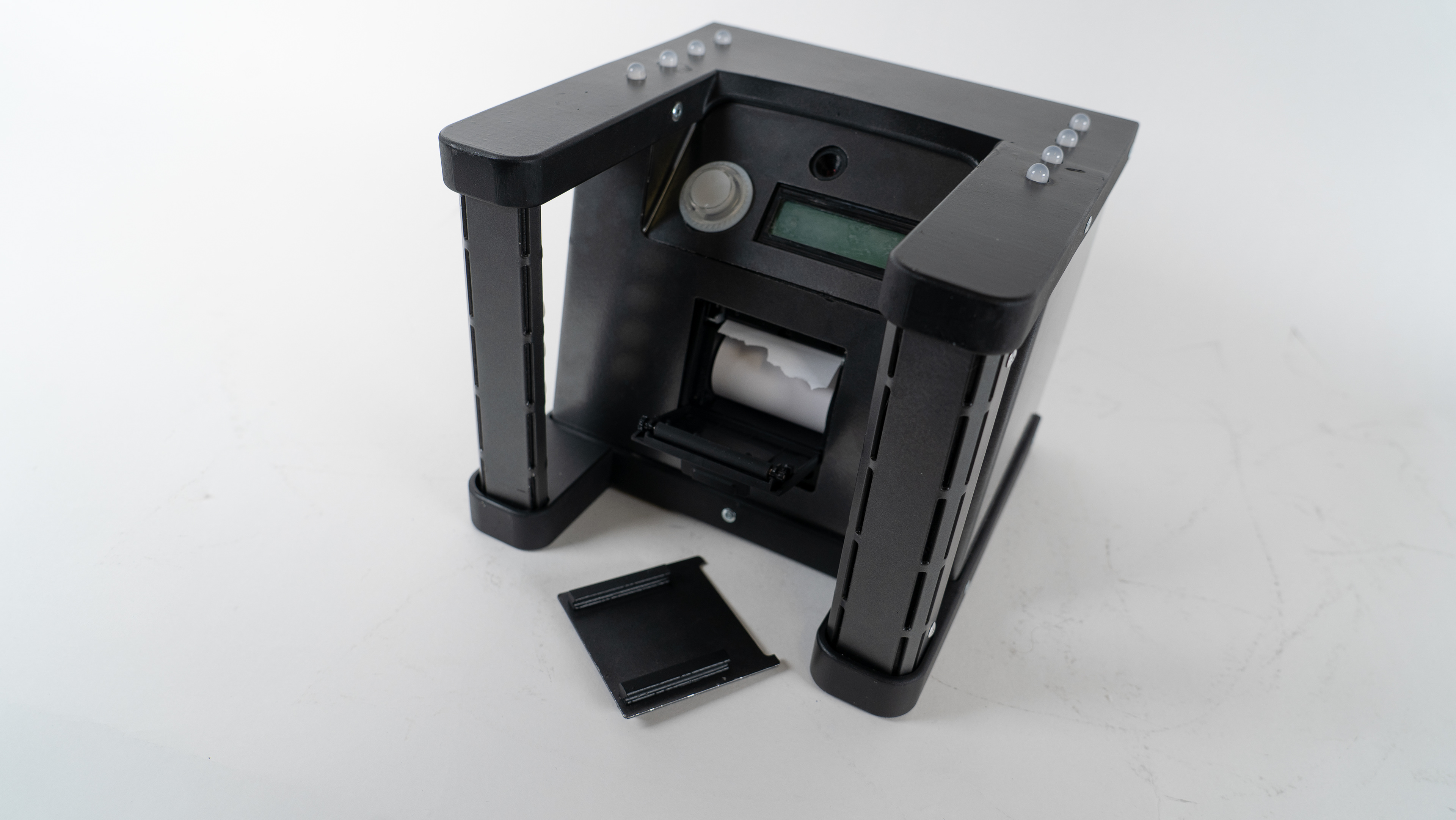 Front view with the printer cover off, for refilling paper
