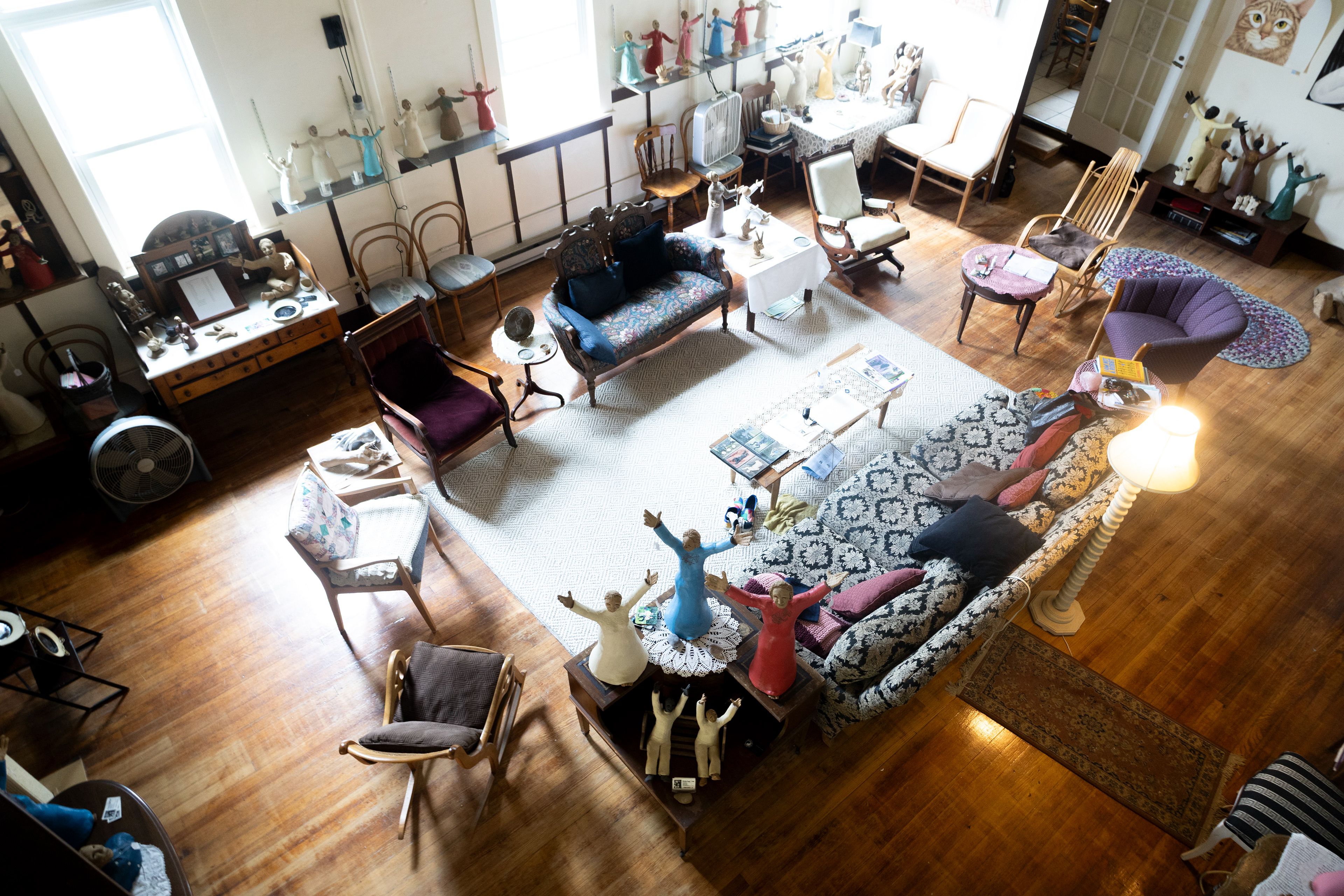 Statues created by artist Kirsten Engstrom stand on display for sale on the first floor of her combined home and art studio 