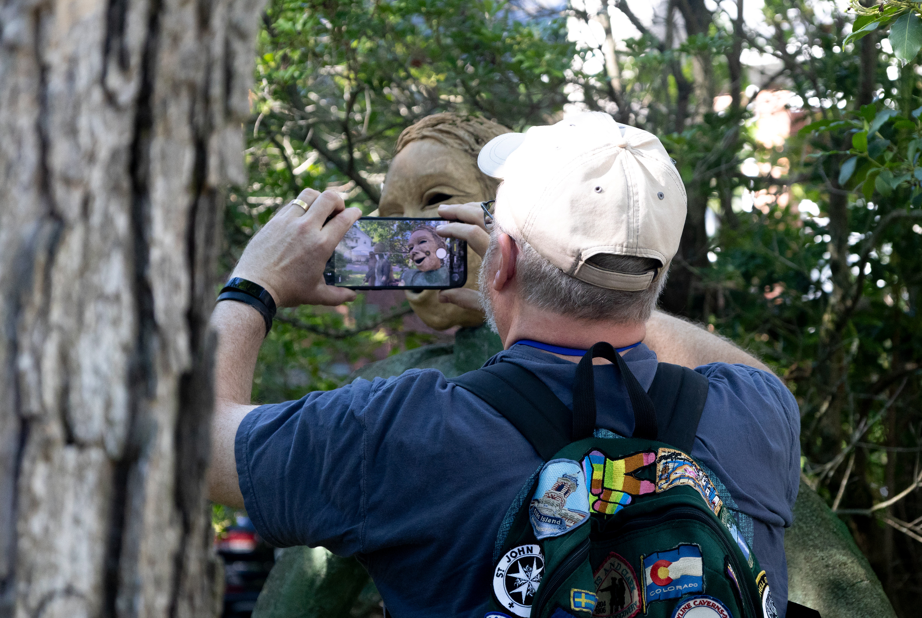 Contestant Frank Burdette photographs Engstrom’s statue “Fernanda,” which means Ardent for Peace. The image was taken for the “Ya Ya” statue photography contest, which offers a prize package worth up to $300.