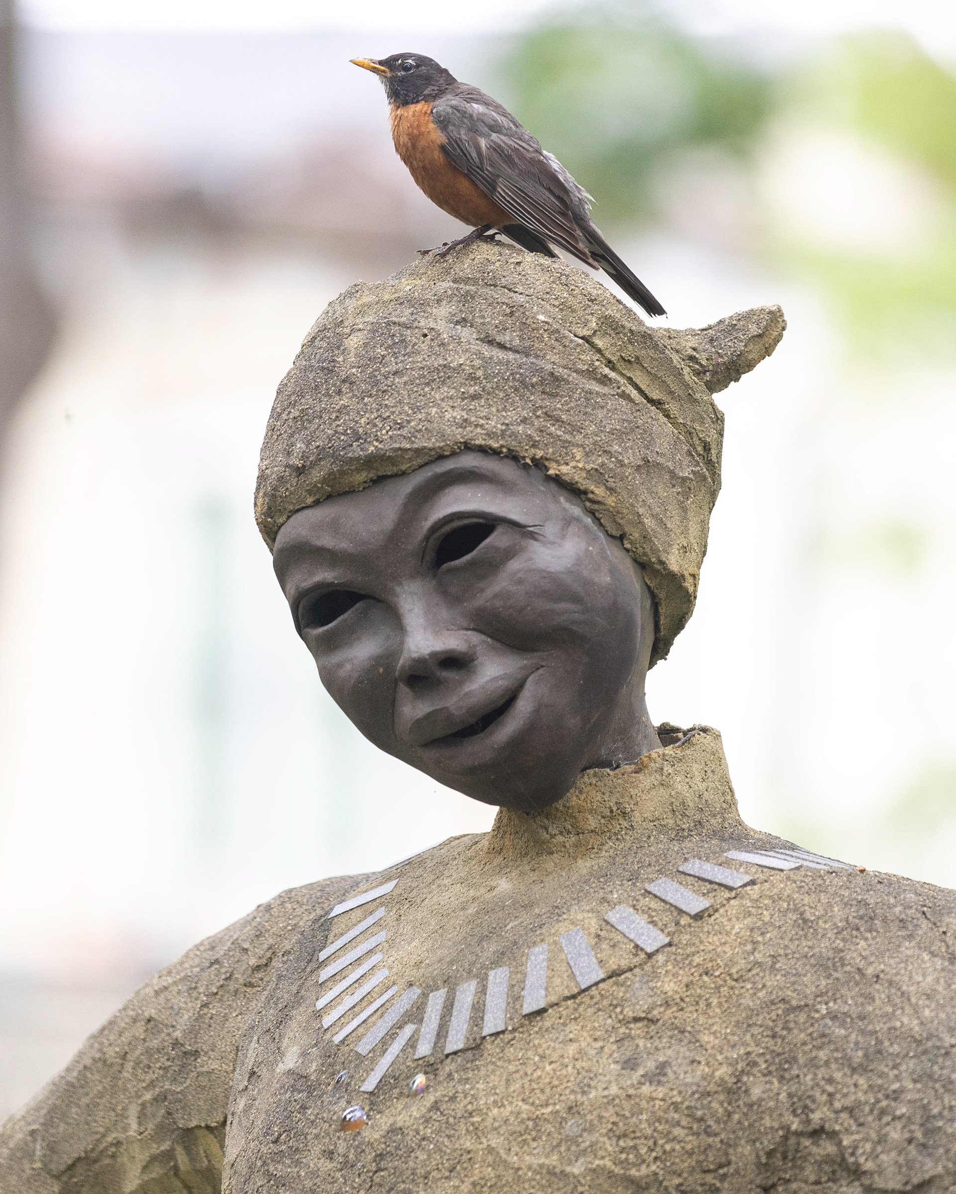 A robin lands on Engstrom’s “Bah Hoa Binh,” meaning Esteemed Woman of Peace.