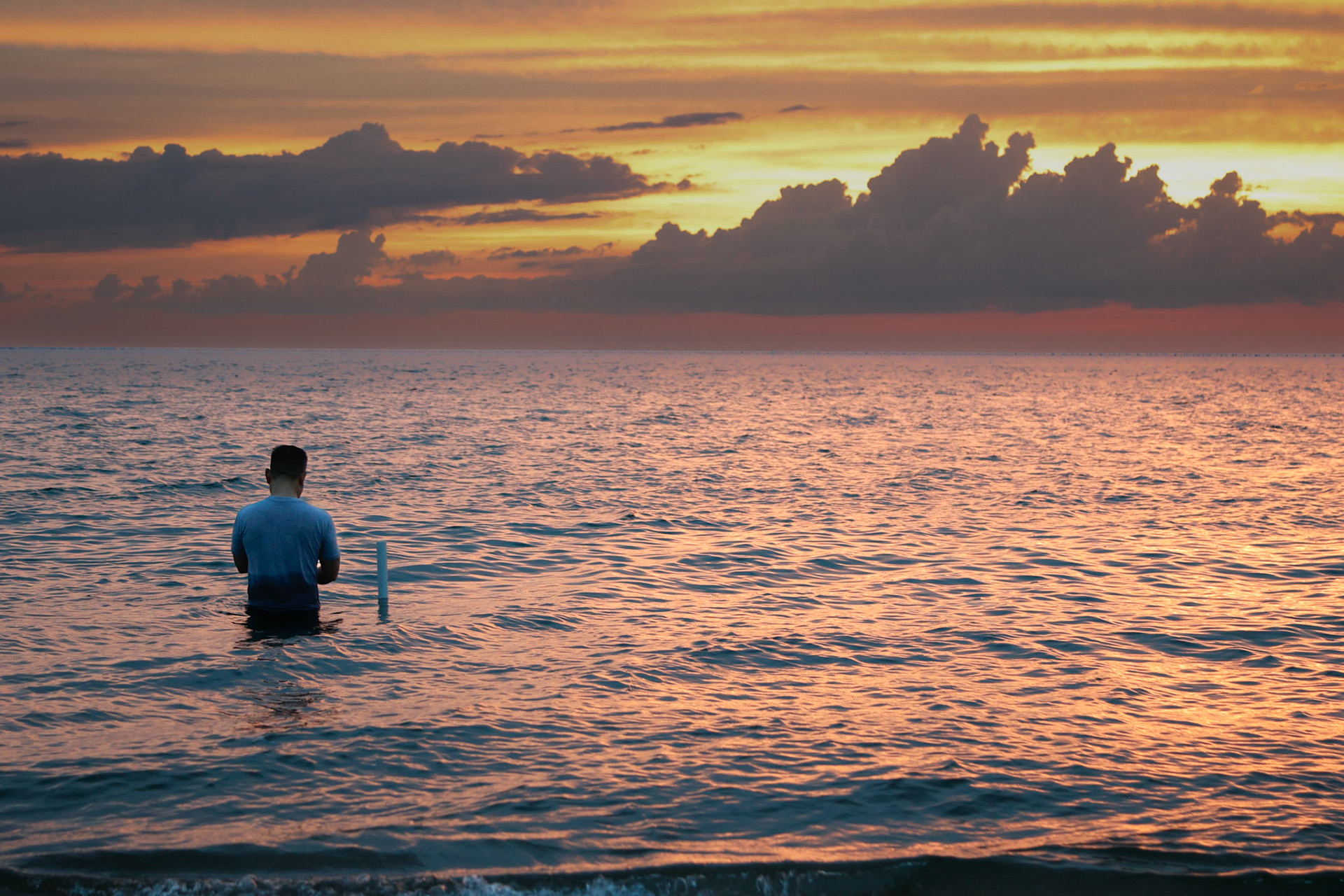 A man fishes in the Chesapeake Bay near First Landing State Park.