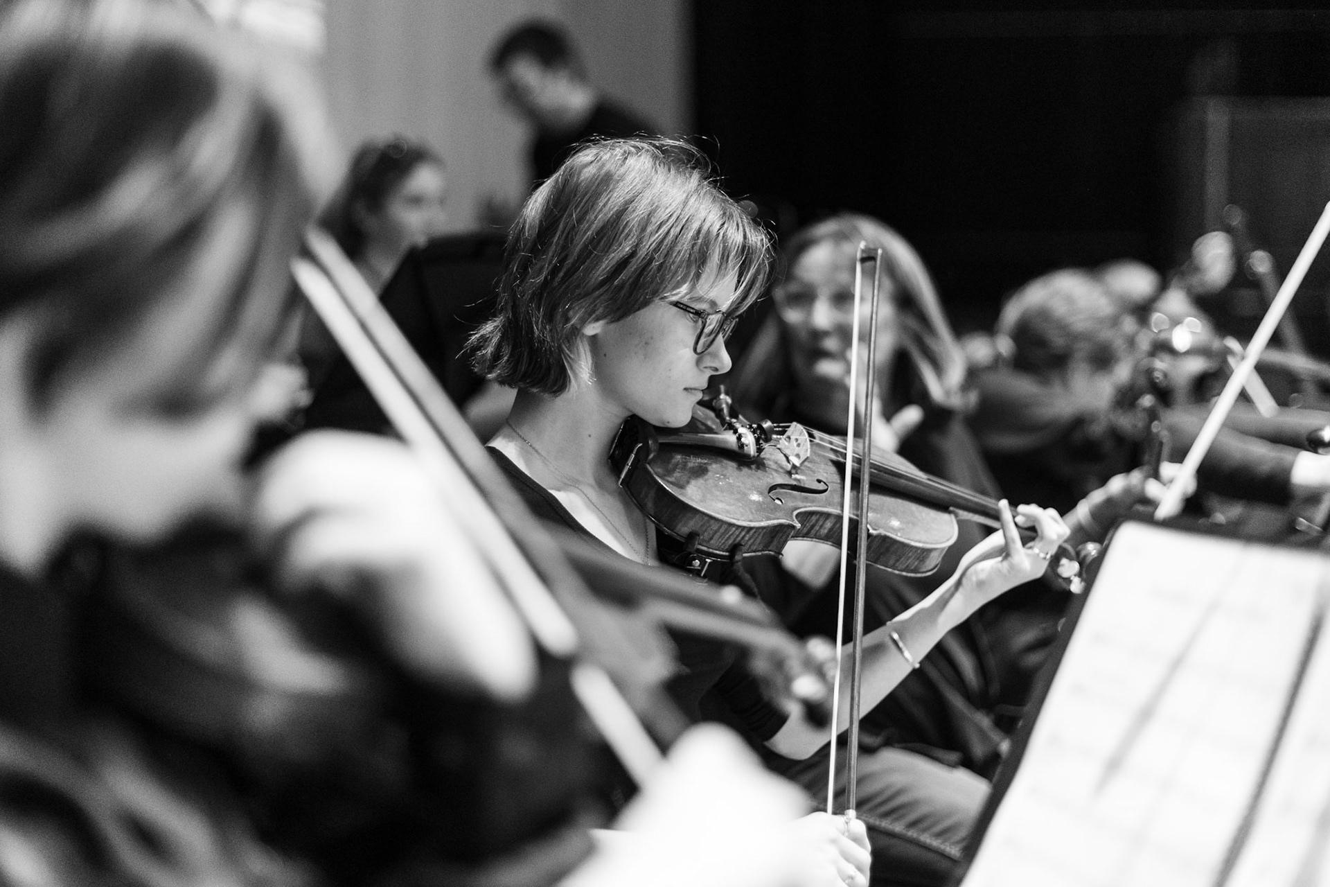 Olivia Colvin playing violin in the pit for West Side Story put on by CHS Theatre. 