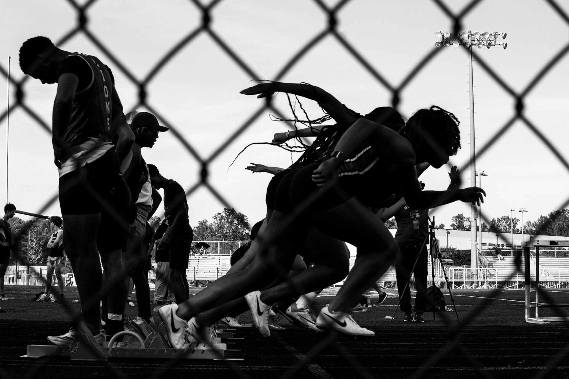 Sprinters launch out of their blocks at a track meet at Albemarle High School. April 15, 2026