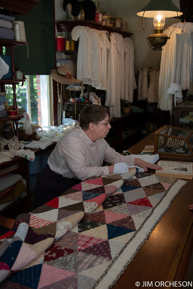 Taking orders from the Eaton's catalog. The "quilt" showed the fabrics that the clothes could be ordered in.
