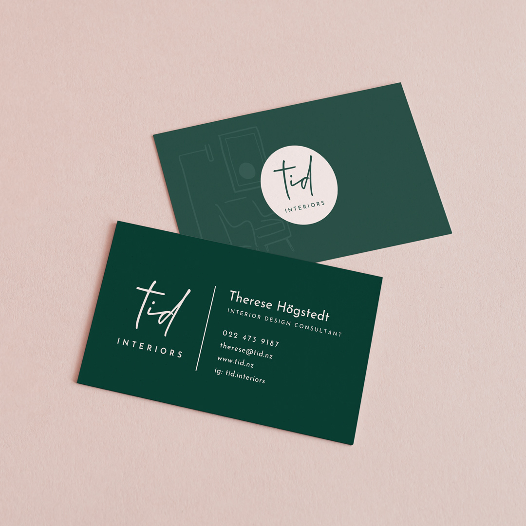 Image of teal green and pink branded business card for TID Interiors