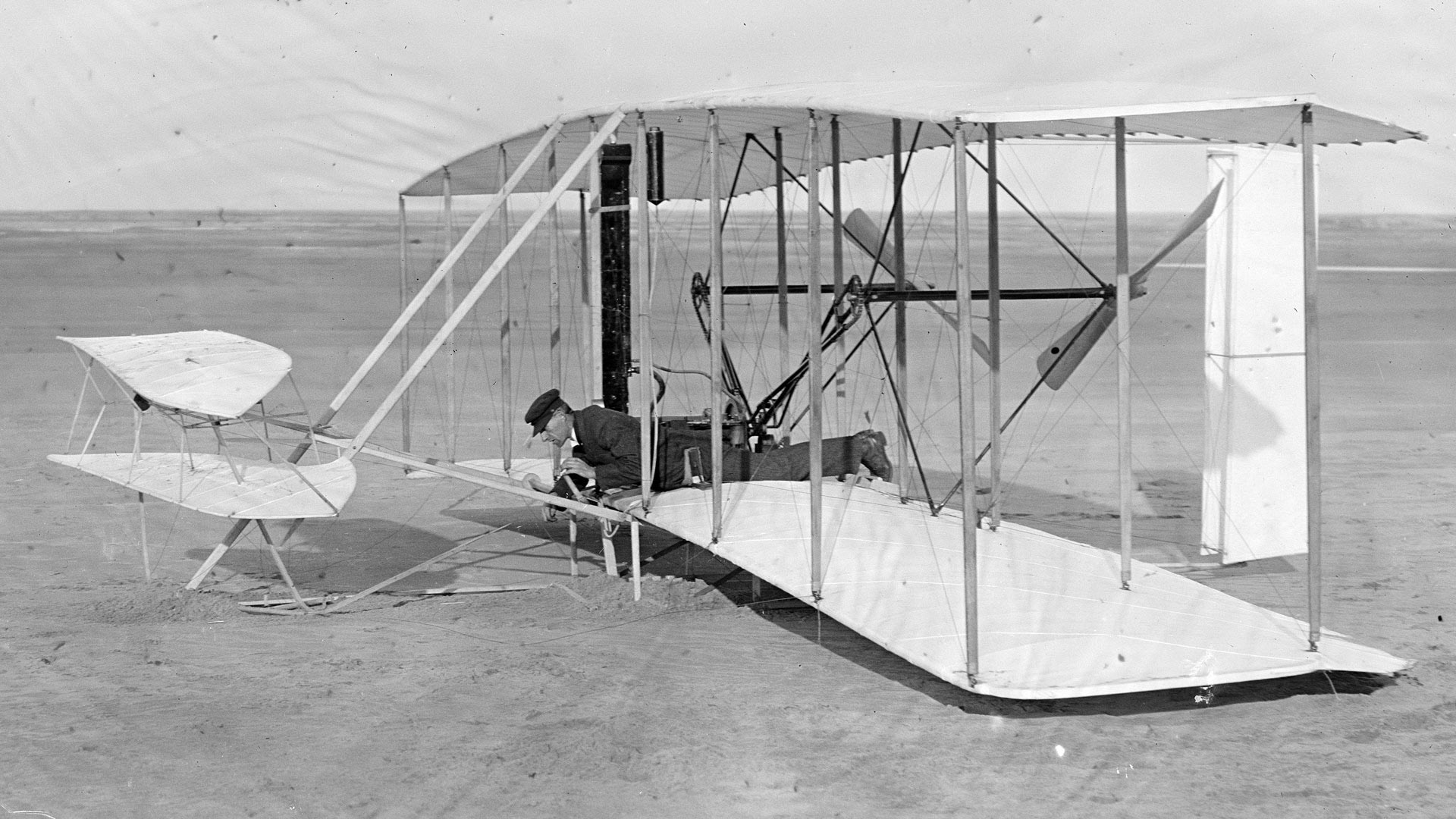 Wilbur Wright in damaged Flyer just after failed trial of December 14, 1903; Kitty Hawk, North Carolina.