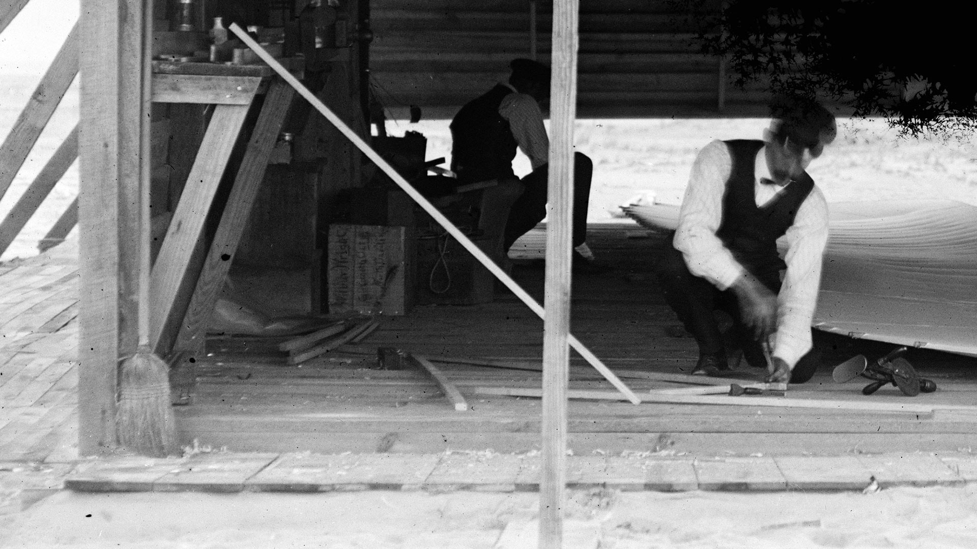 Wilbur and Orville Wright assemble the Flyer in camp building, October, 1903, Kitty Hawk, North Carolina.