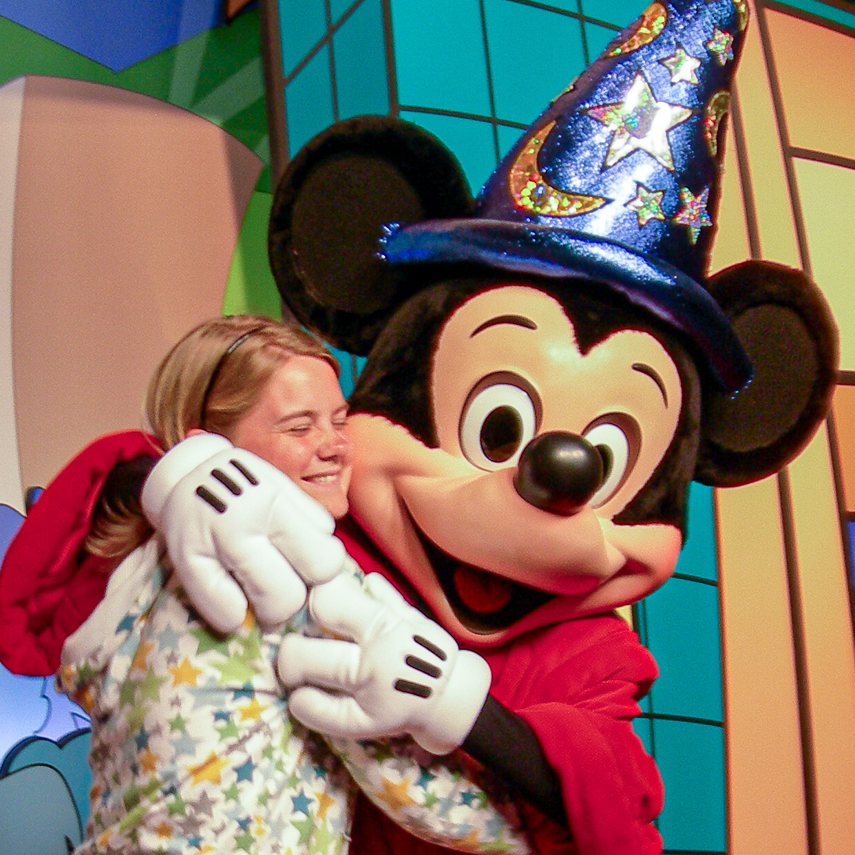 Sorcerer Mickey Mouse giving Whitney Strouth a hug at Hollywood studios circa 2008.