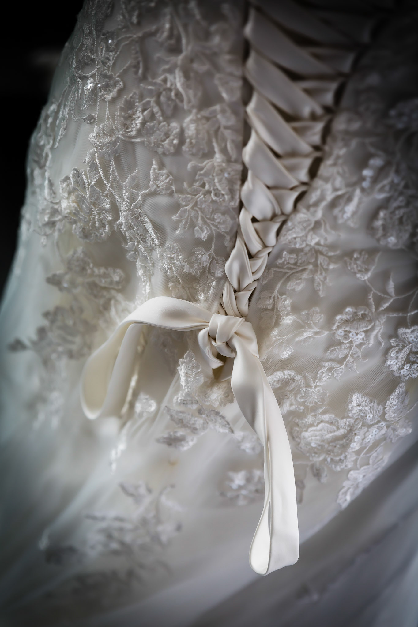 Detailed shot of the back of the wedding dress by Wedding Photographer in Dudley
