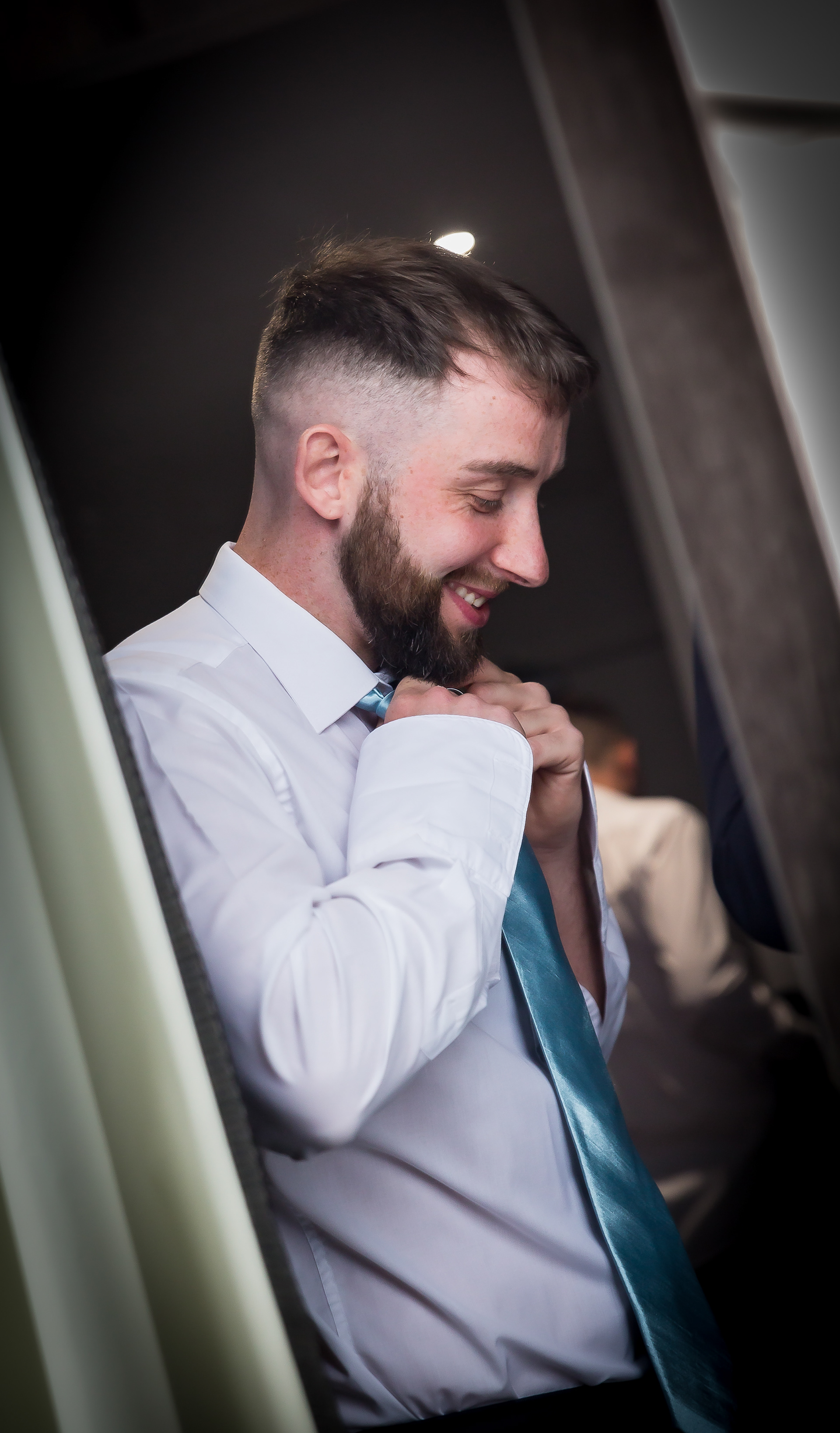 Groomsman getting ready by The Multi Media Market Wedding Photography in Dudley.