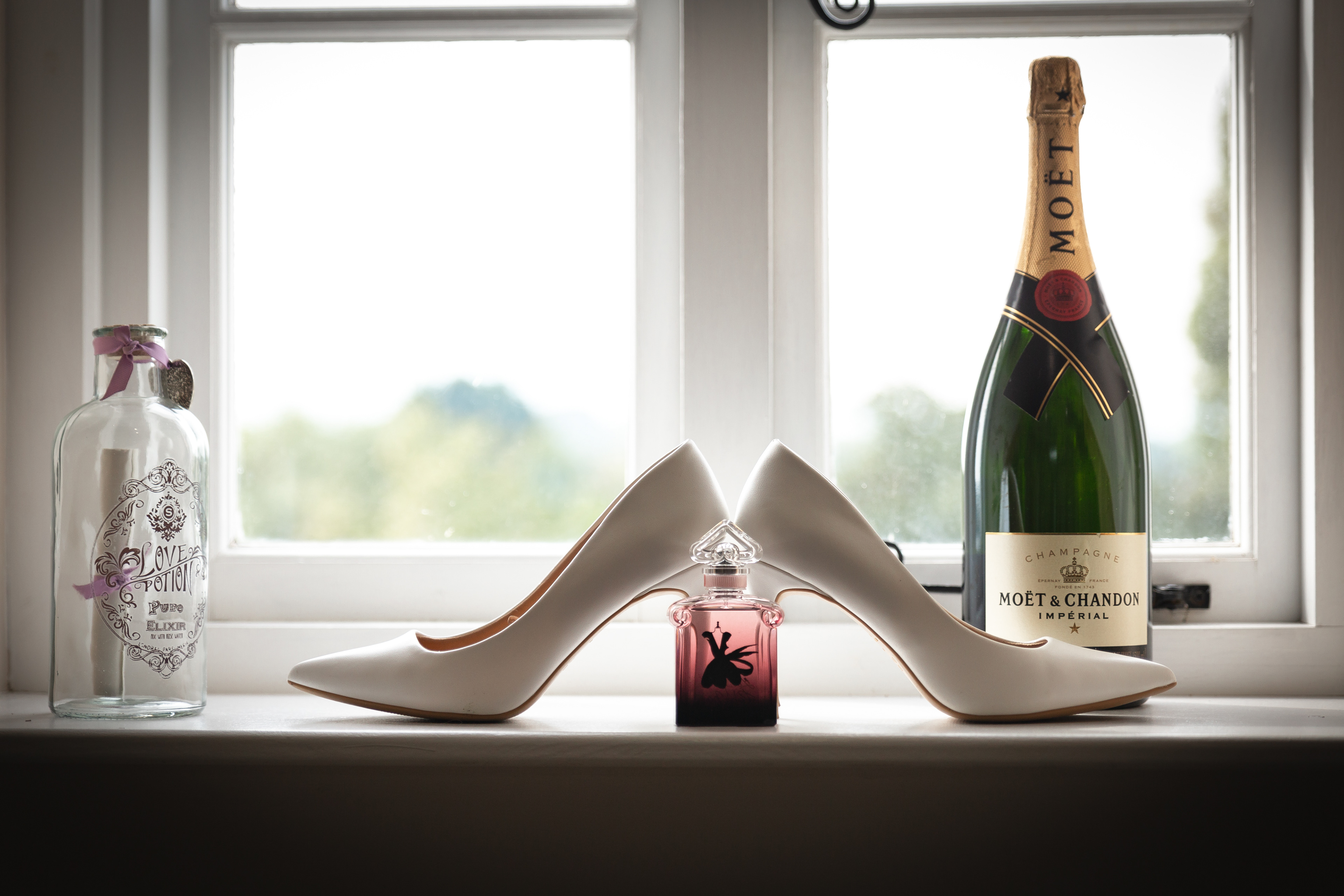 Wedding shoes and perfume y The Multi Media Market Wedding Photography in Dudley.