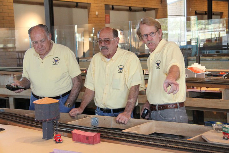 Yellow shirts on, the tech team of Bob Field, Bill Rodgers and John Biely.