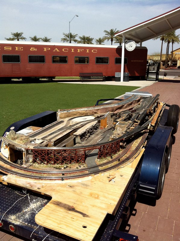 The remains of the South End industrial area are loaded onto the flatbed trailer going to their new home.