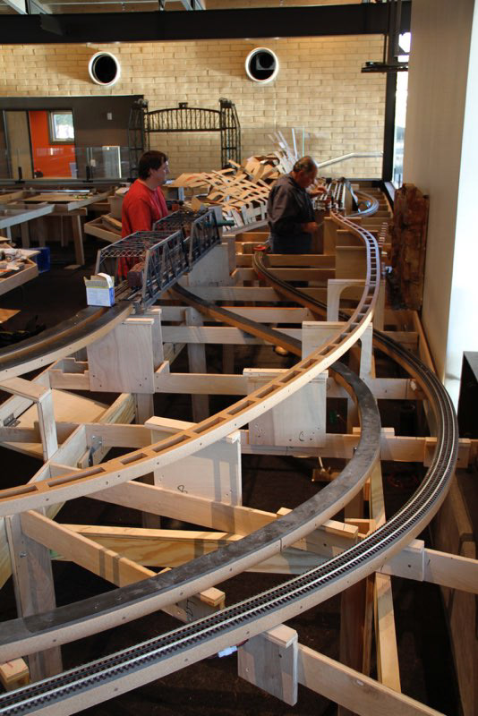 Bob Field and Wesley Schriver work on the last section of the upper track.
