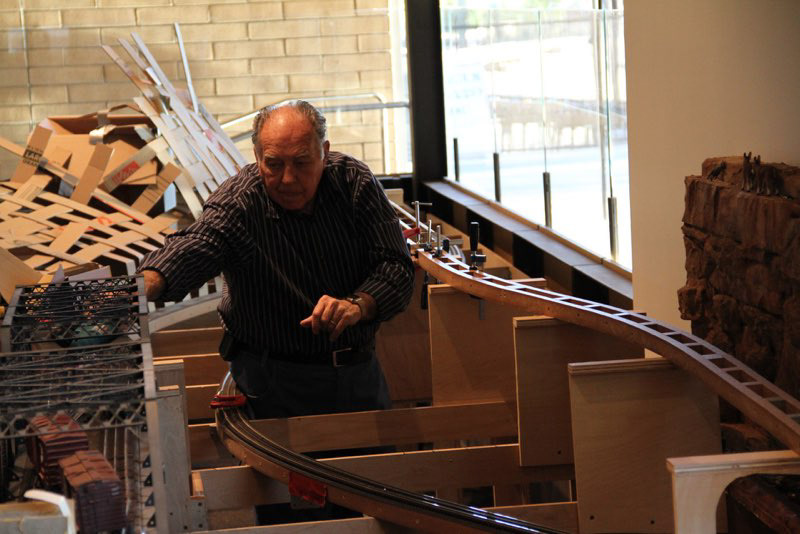 Bob Field is working from a potential access hole. Mount Home Depot is in the background.