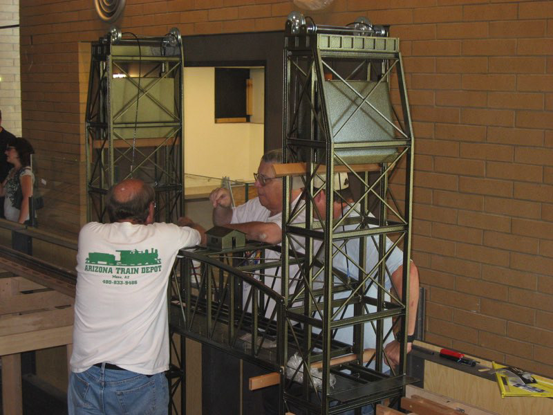 The Lift Bridge arrives. Bill Rodgers, Gerry Pfeiffer, and Wesley Schriver contemplate the installation process.