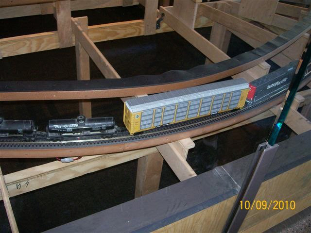 View is great with no glass. The track electrical interconnect is below the tank car.