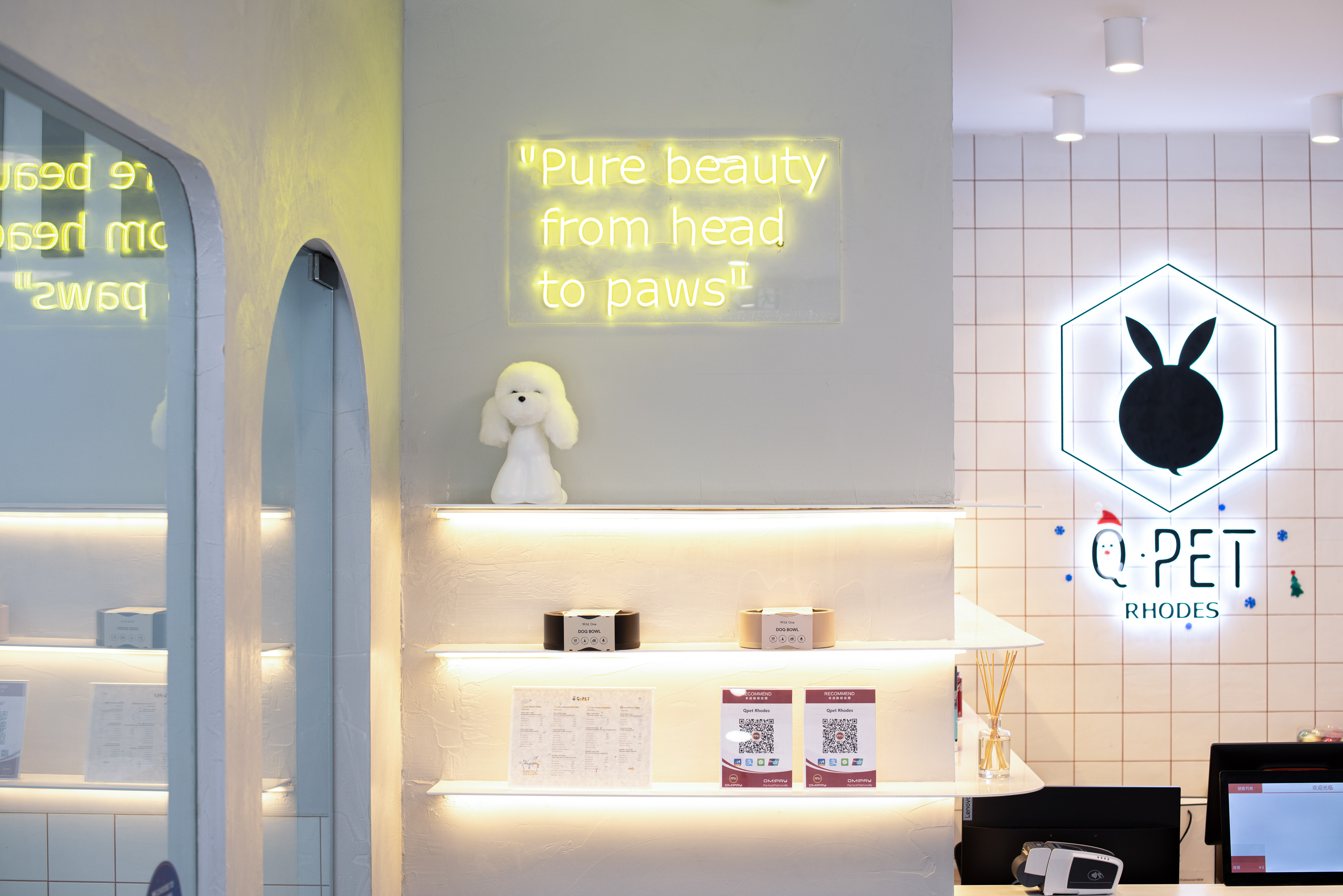 The floating shelving unit with lighting continues with the design language.