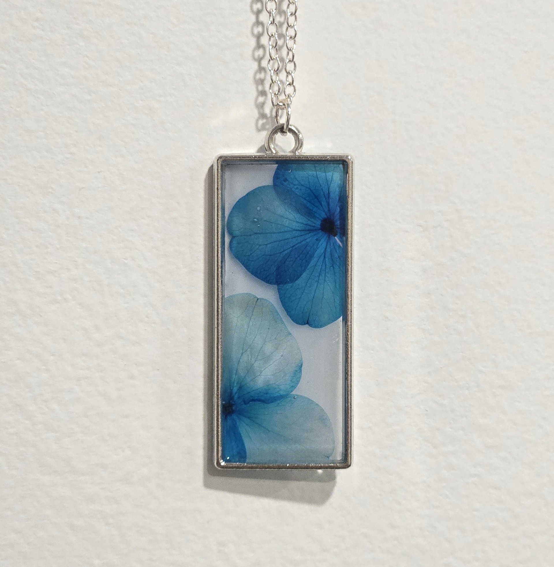 2. blue flowers on white, silver frame