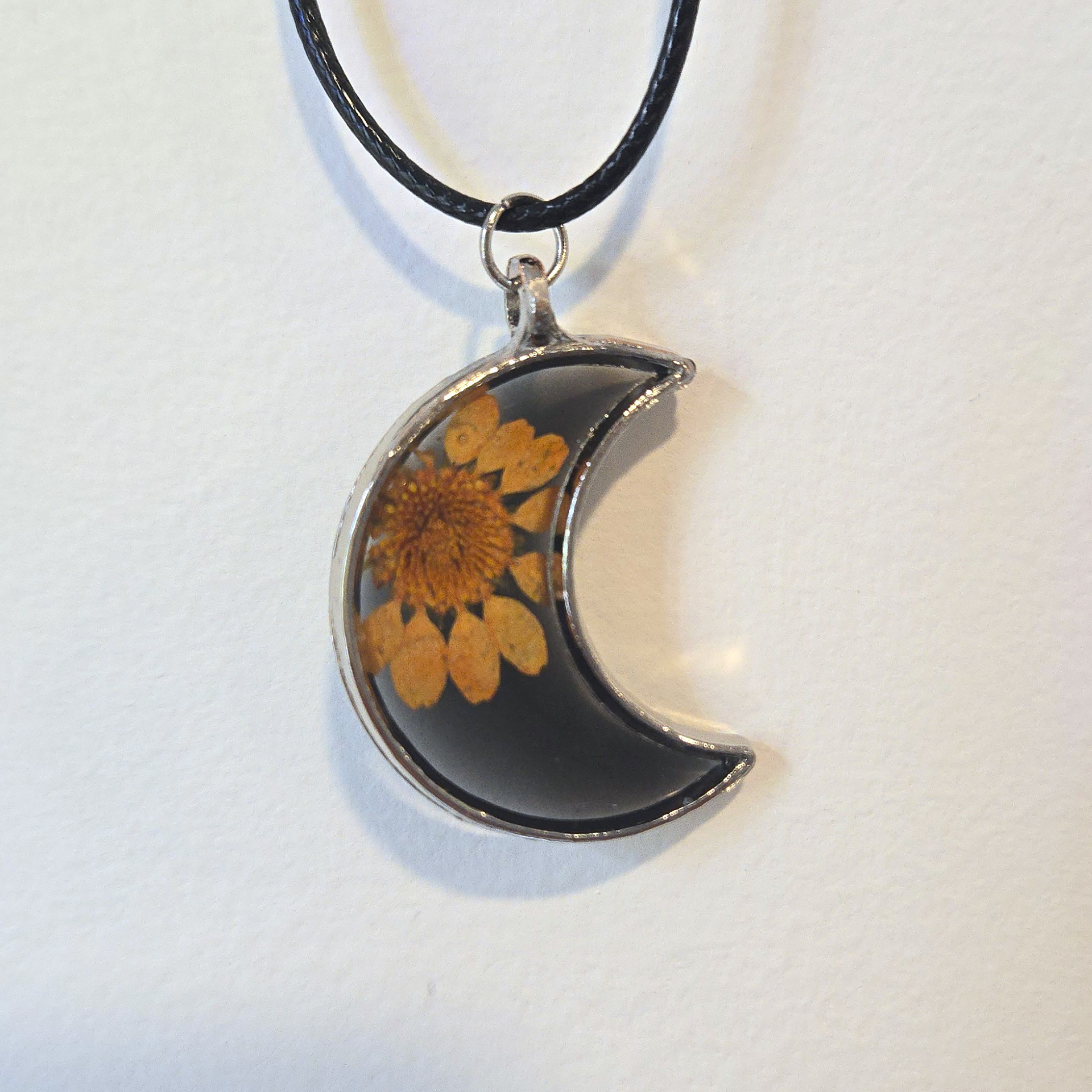 27. orange daisy in black moon, silver frame