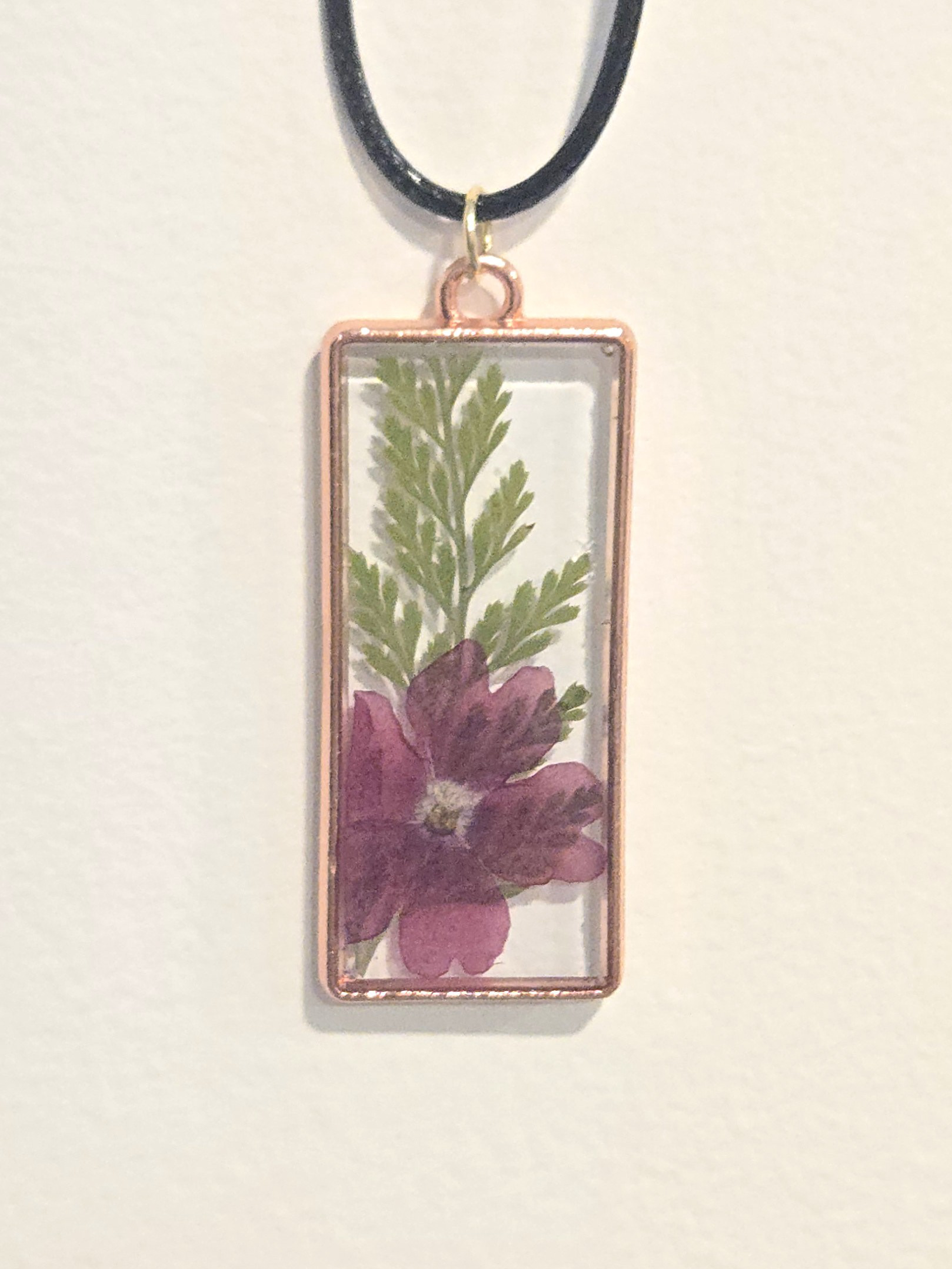 33. burgundy flower in clear rectangle, rose gold frame