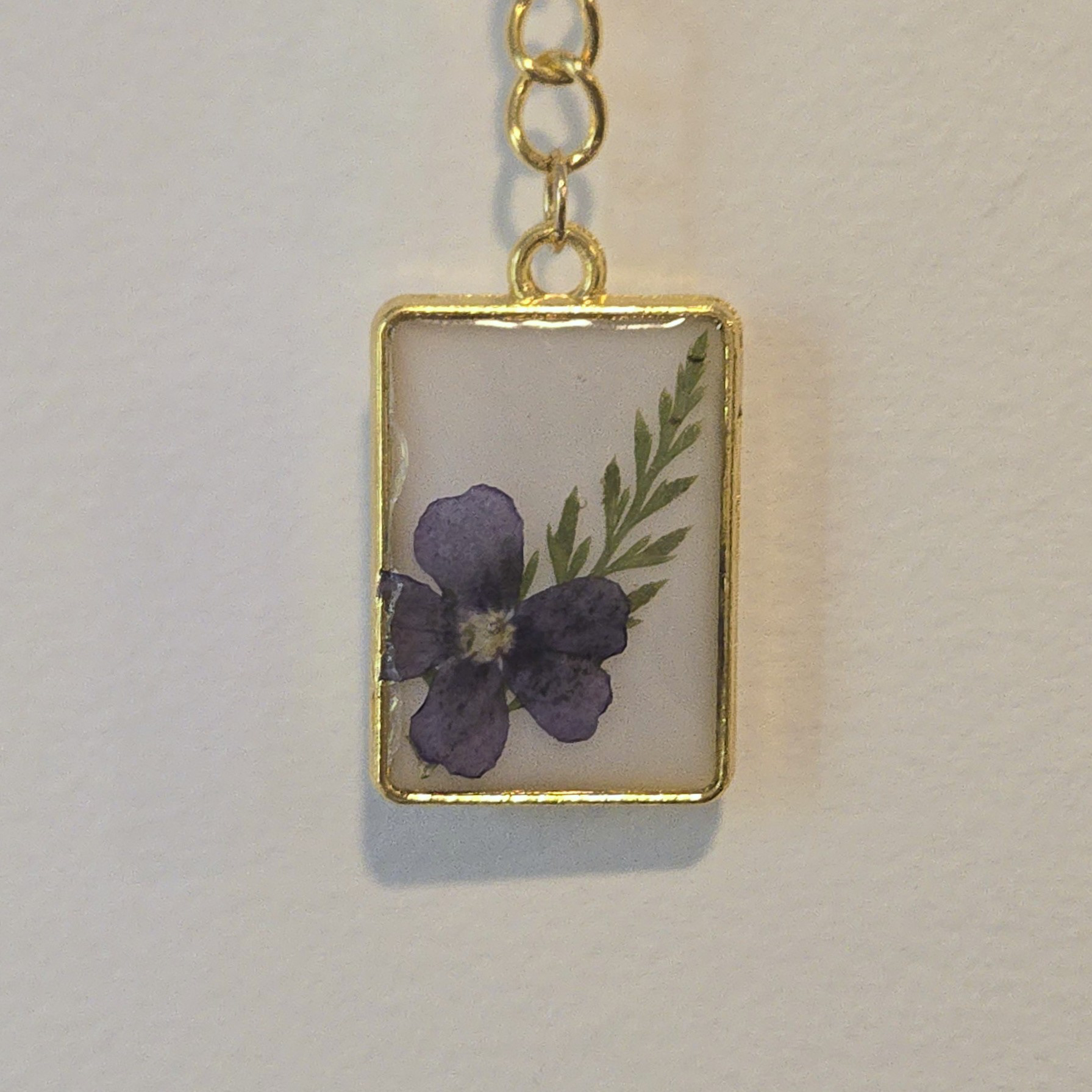 29. indigo flower in white small rectangle, gold frame