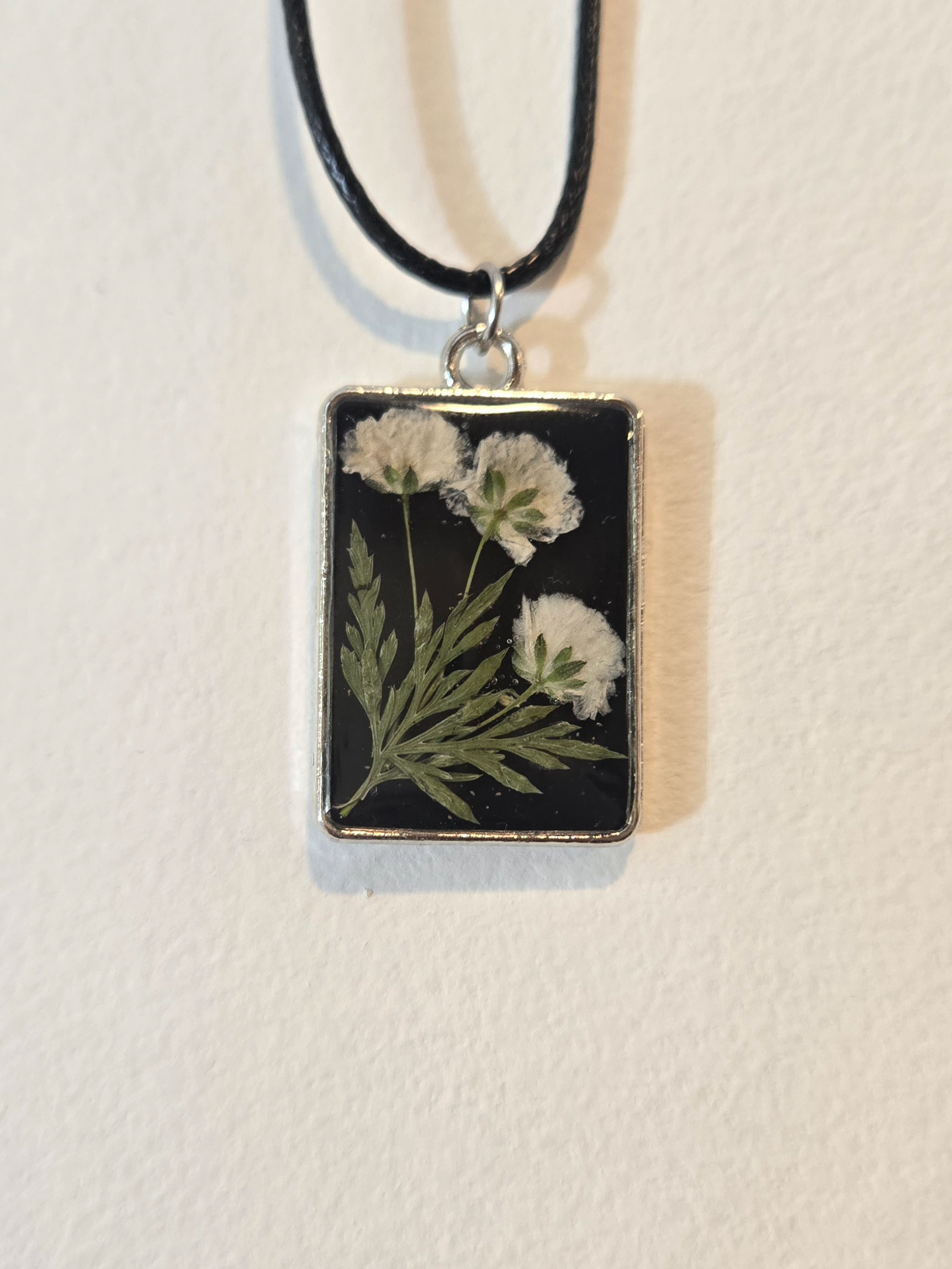 7. white flowers in black rectangle, silver frame