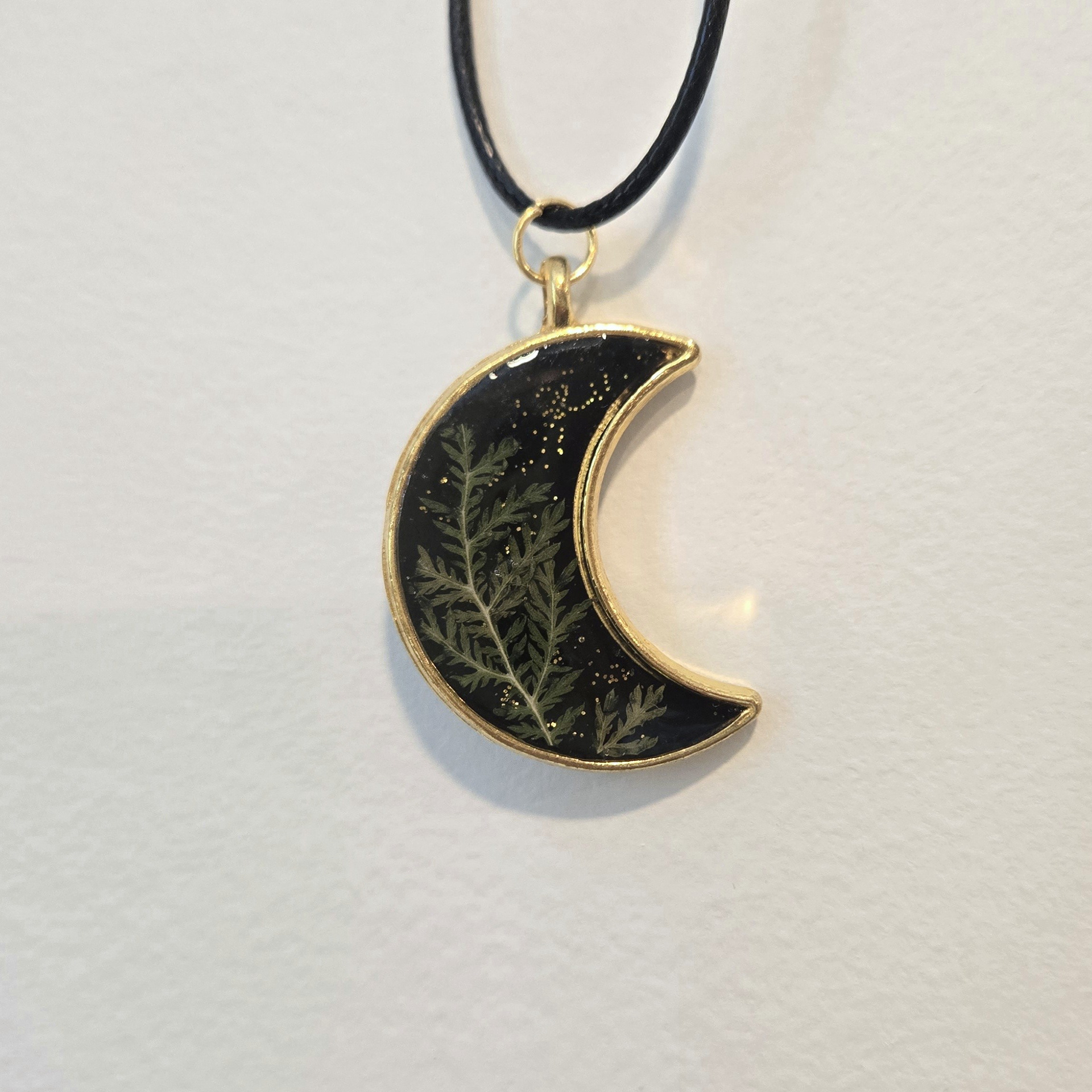 4. green plant in black glitter moon, gold frame