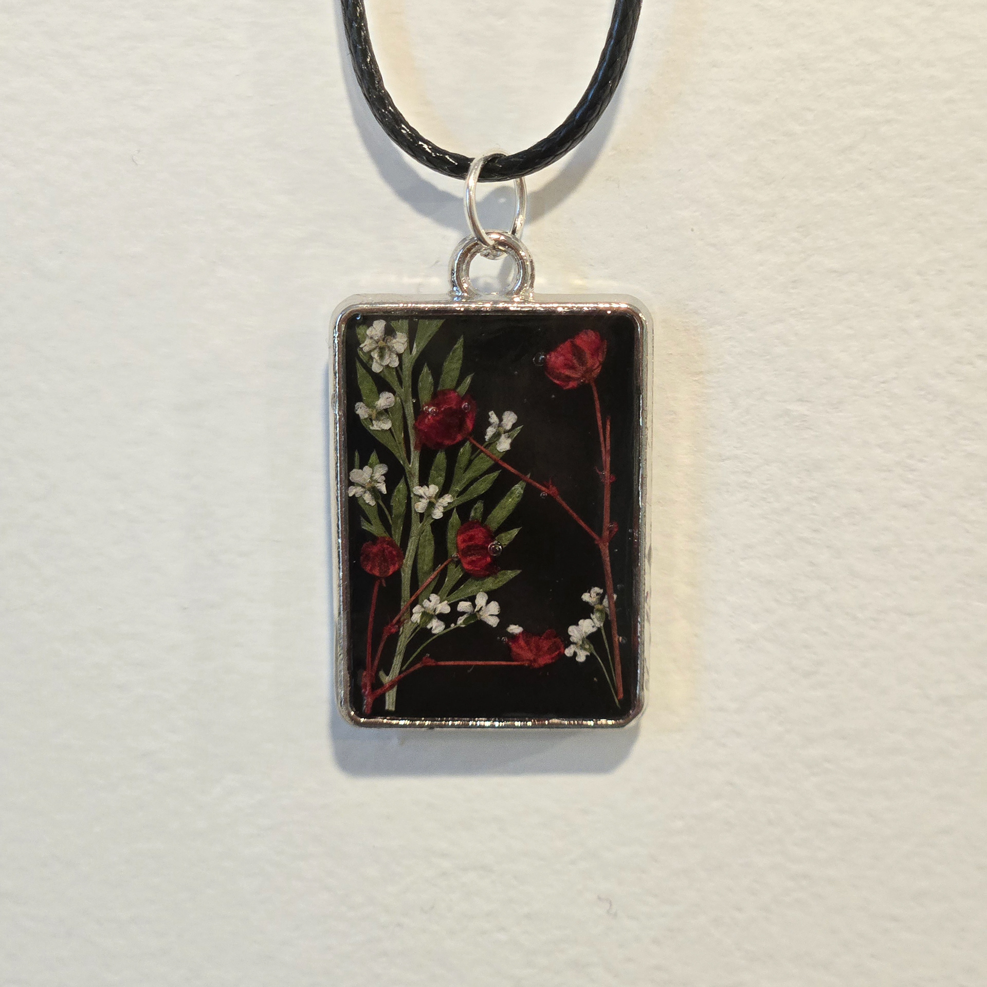 14. red and white garden in black rectangle, silver frame
