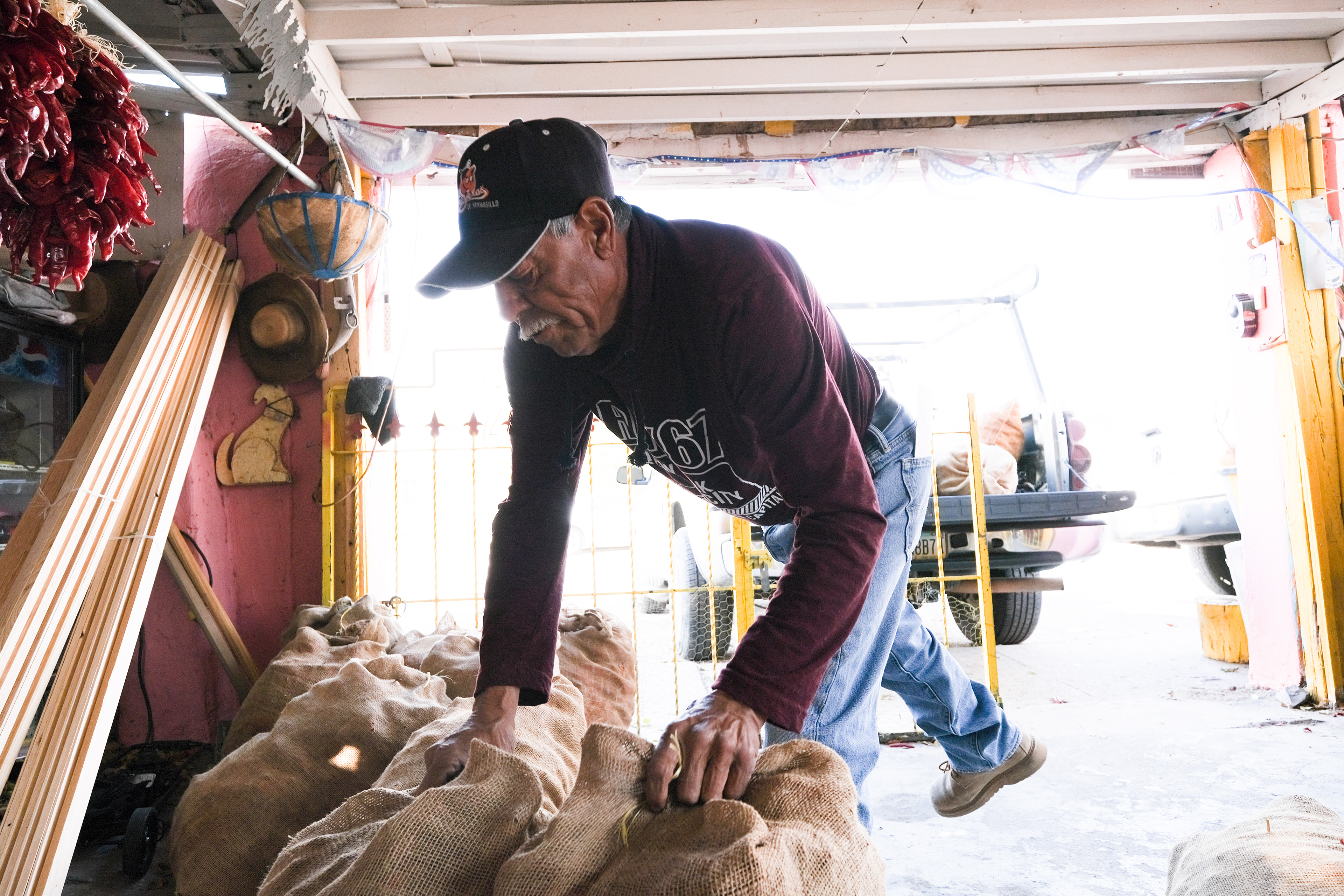 Chile farmer Jorge Lopez loads up his truck. Hatch, New Mexico